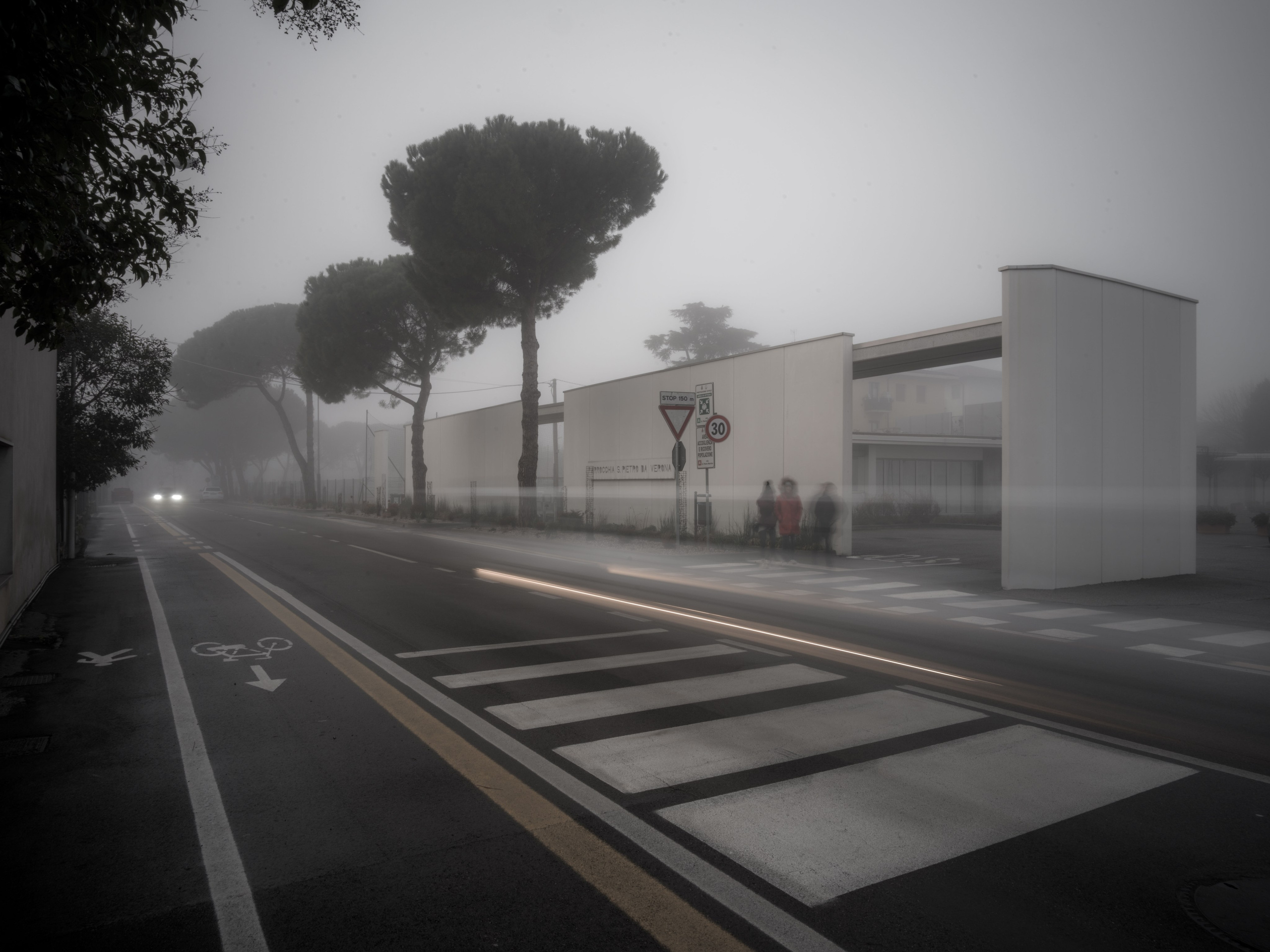 Modern architectural minimalism in winter Verona. Long exposure light trails and soft fog create a clean, contemporary fine art composition for modern interiors.