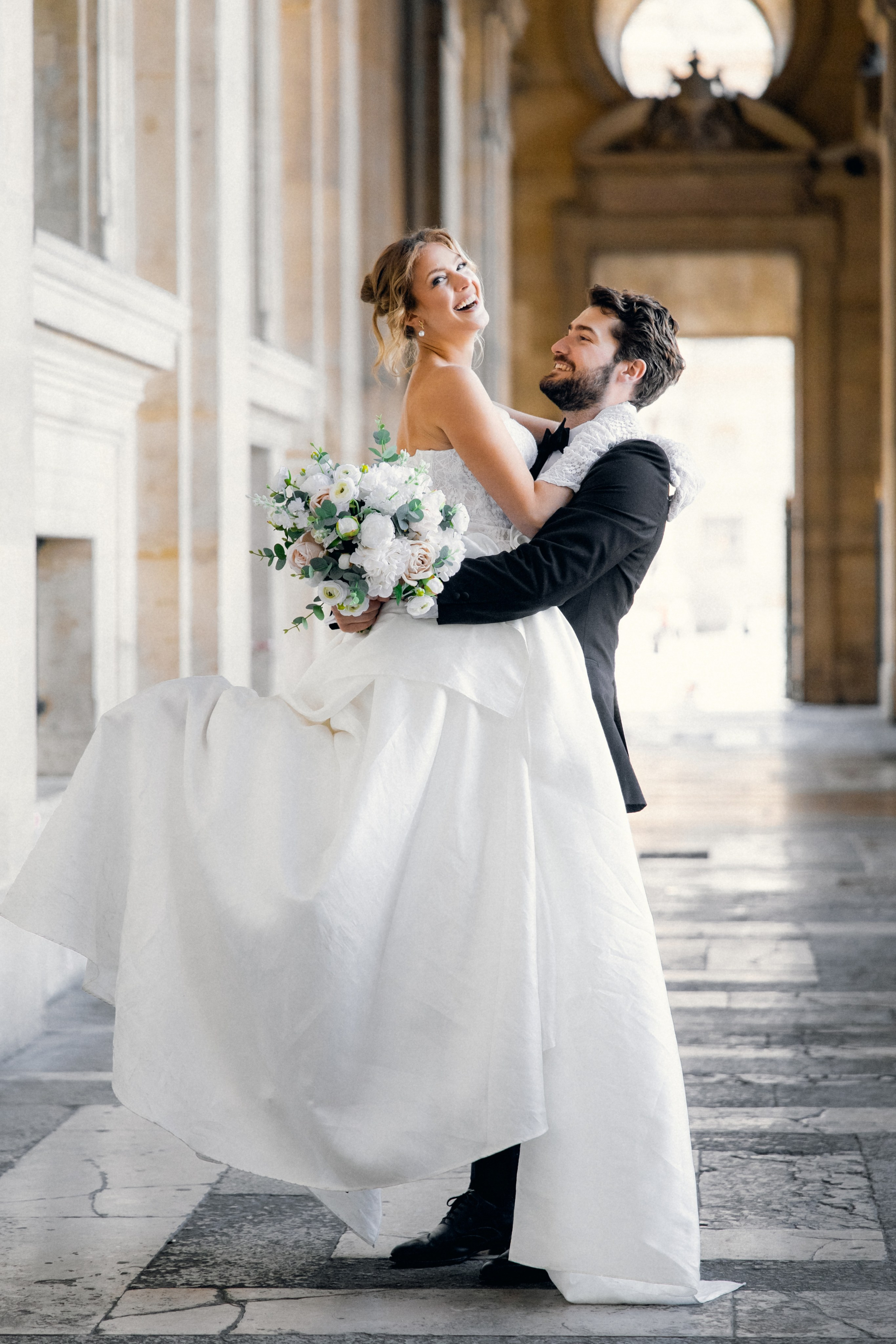 Elegant wedding portrait of bride and groom walking through the streets of ParisRomantic elopement moment captured in soft evening light in Paris, FranceLuxury wedding ceremony setup in a historic French venue with natural floralsCandid black and white photo of a couple at their city wedding in London, UKTimeless couple portrait in front of Marylebone Town Hall, LondonEditorial-style bridal preparation in a classic townhouse in the heart of LondonSoft light bridal portrait in a countryside château wedding in FranceFine art flat lay with French-inspired wedding details and vintage texturesCinematic golden hour photo at a UK estate wedding with historic architectureLuxury wedding tablescape with candles and florals at a London reception