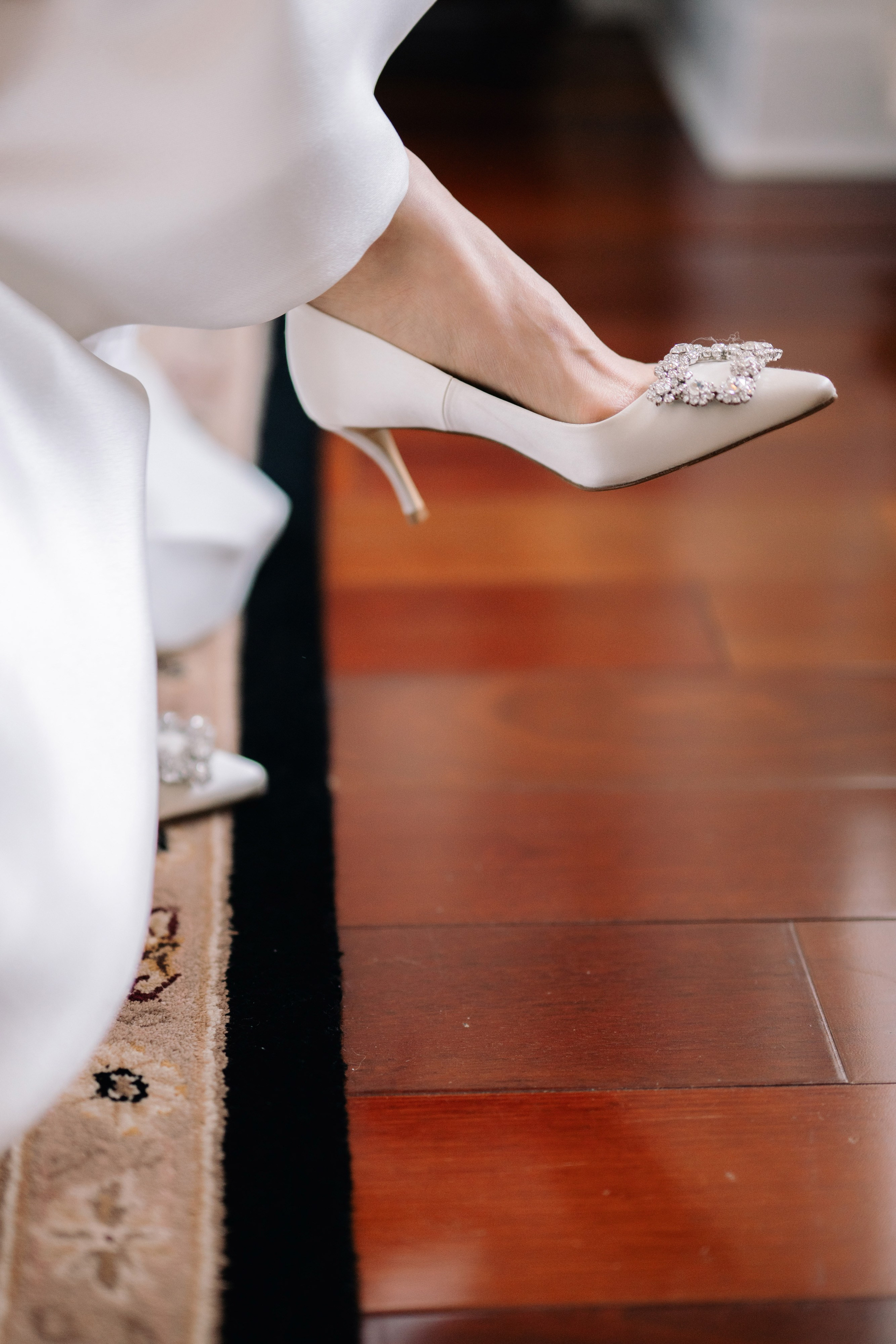 a close up of a bride's shoes
