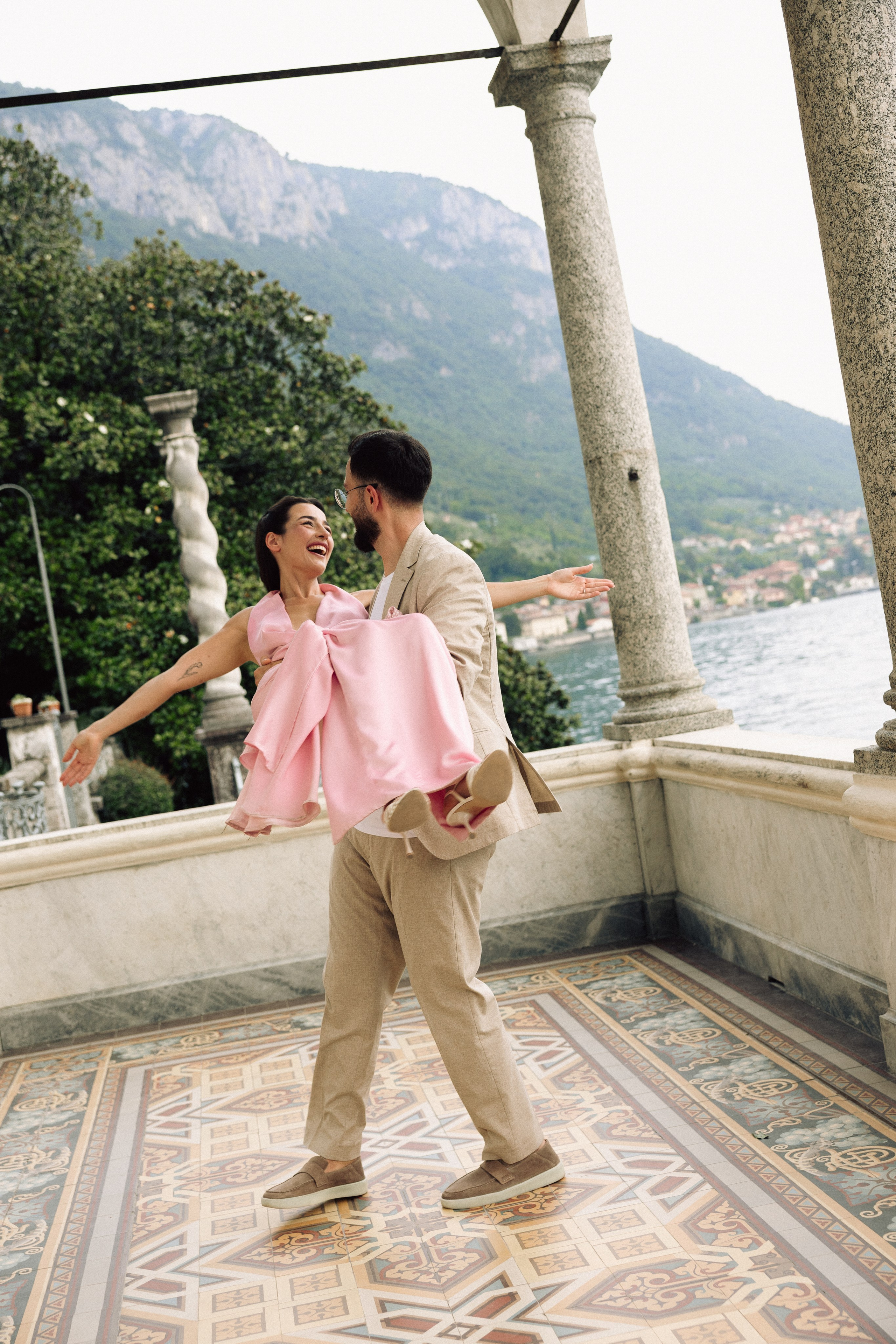Newly engaged couple embracing after a marriage proposal on Lake Como at Villa Monastero