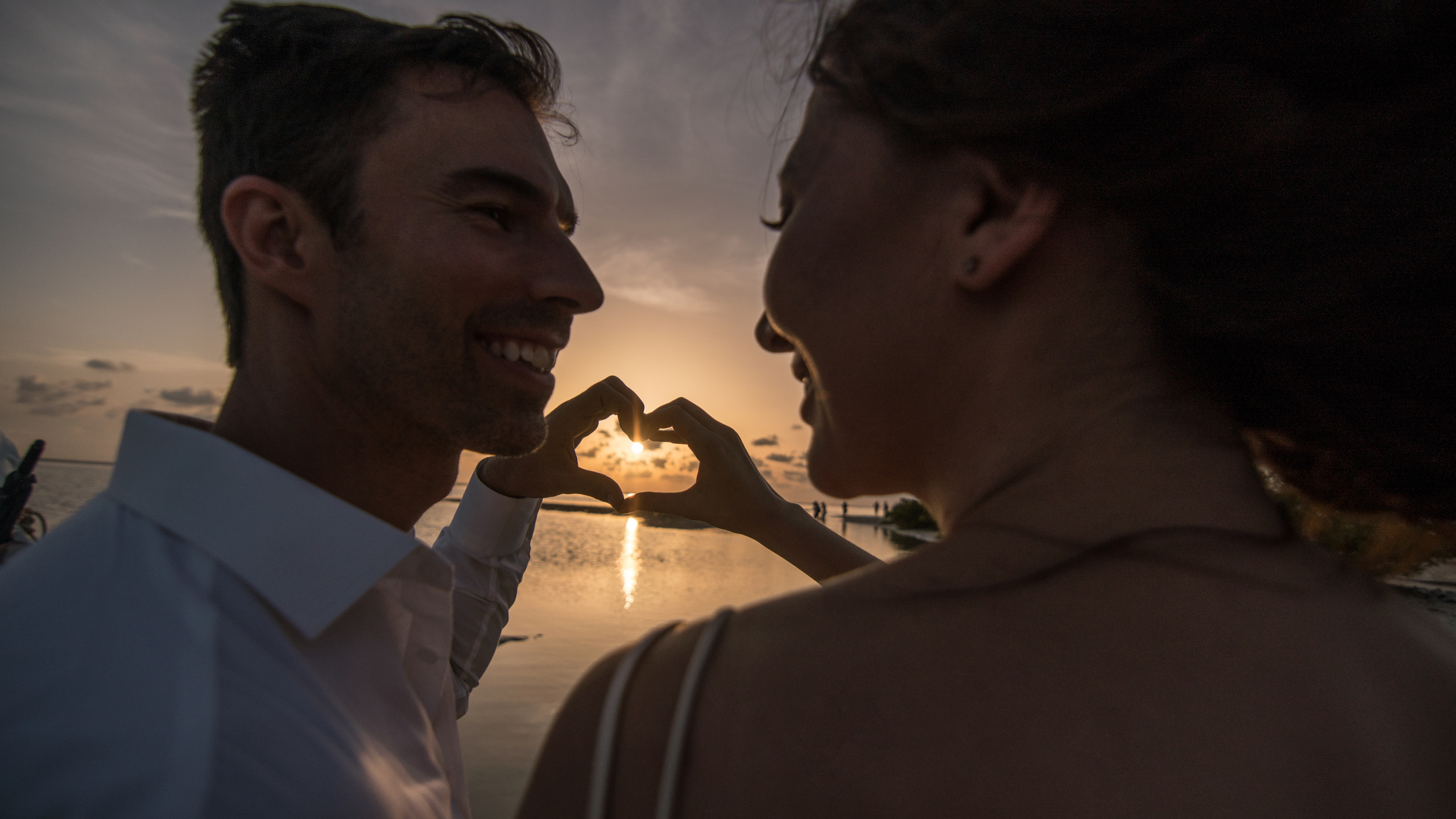 Eco-style destination wedding shoot with couple by local boat