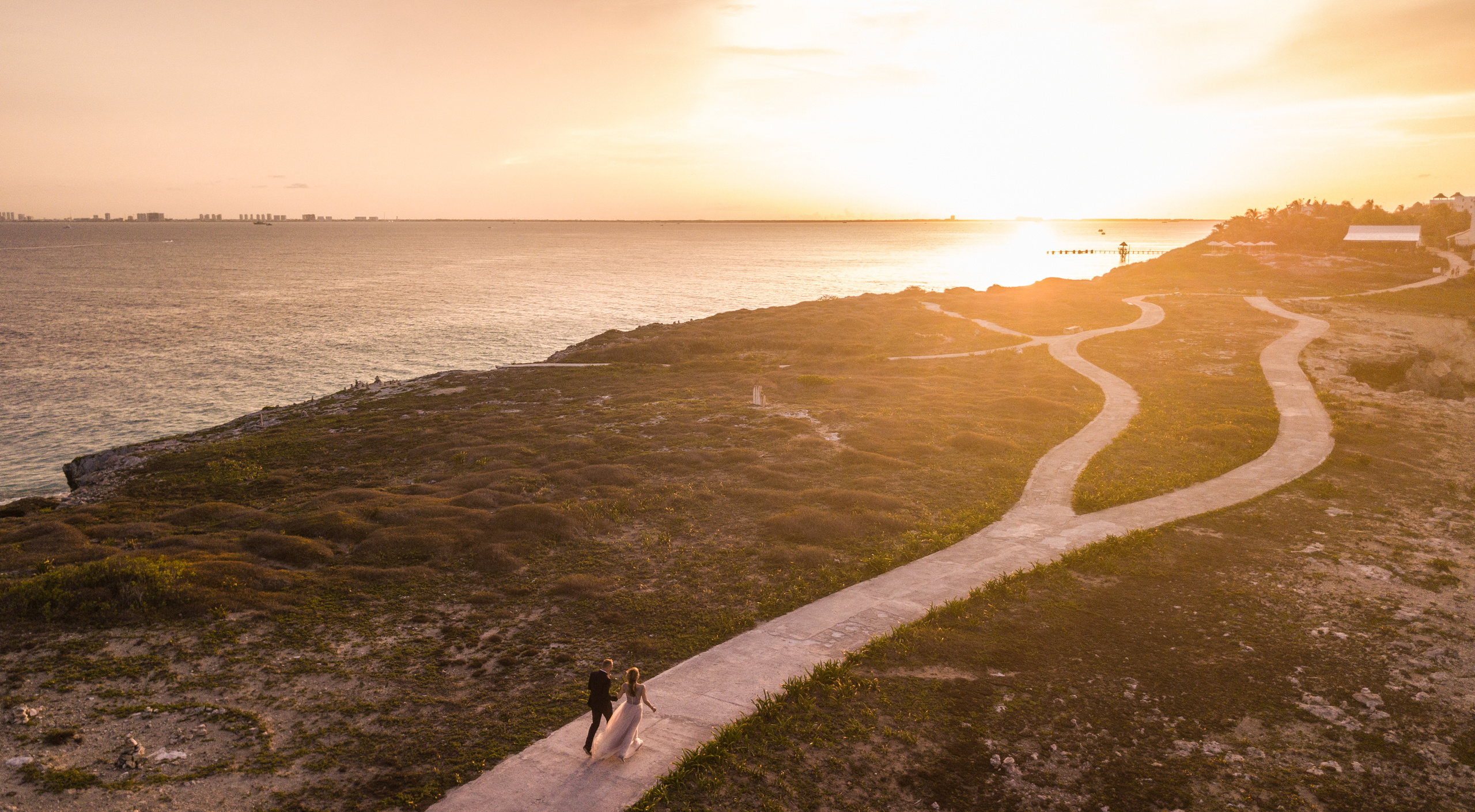 Dramatic love story captured on island cliffs near Cancun, luxury photoshoot 