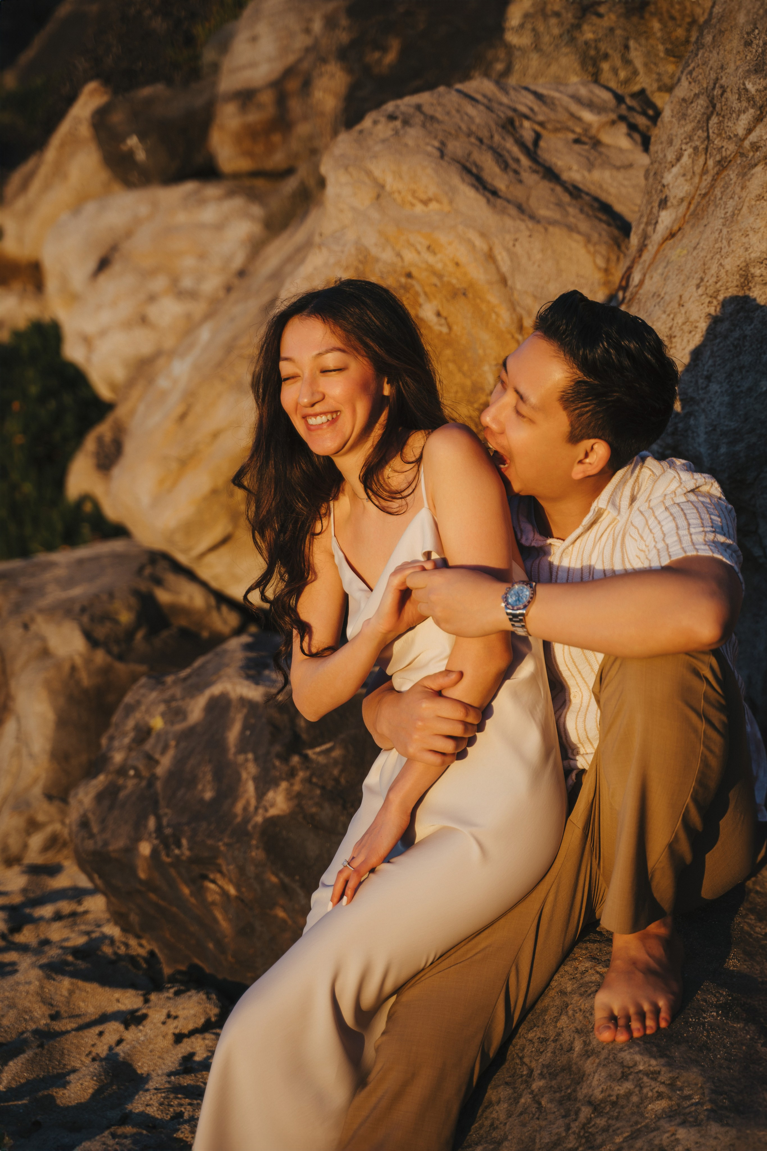 A photo shoot on the San Francisco beach at sunset. Engagement session. 