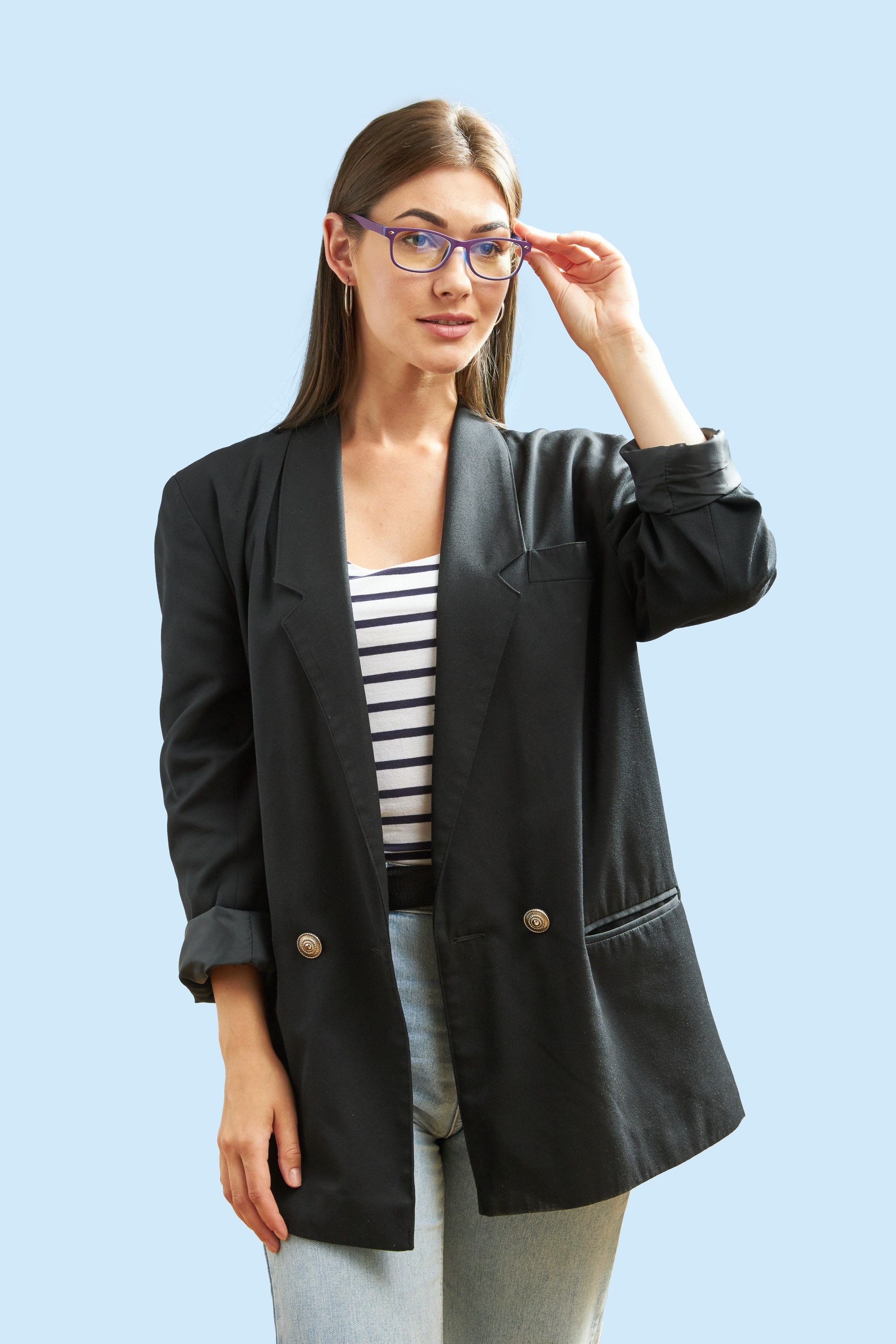 Eyewear model photoshoot - studio portrait of a young lady on light blue background - photographer Andrey Dunin