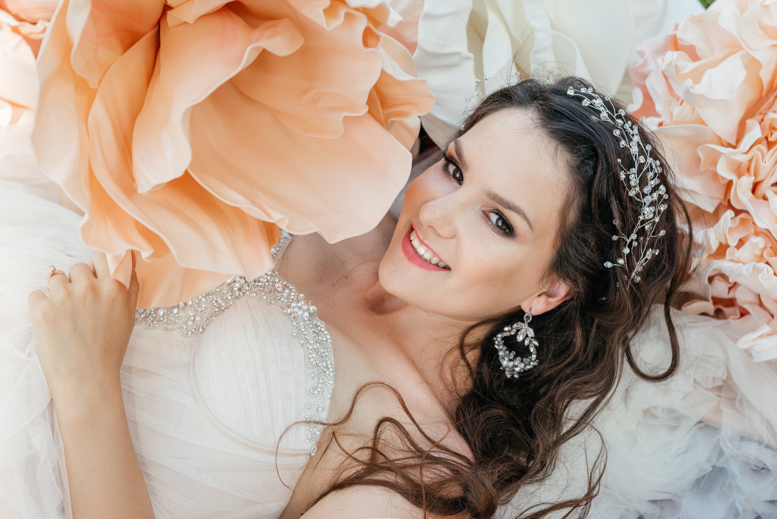 A happy and amazing beautiful bride in a beautiful wedding dress with flowers. Switzerland