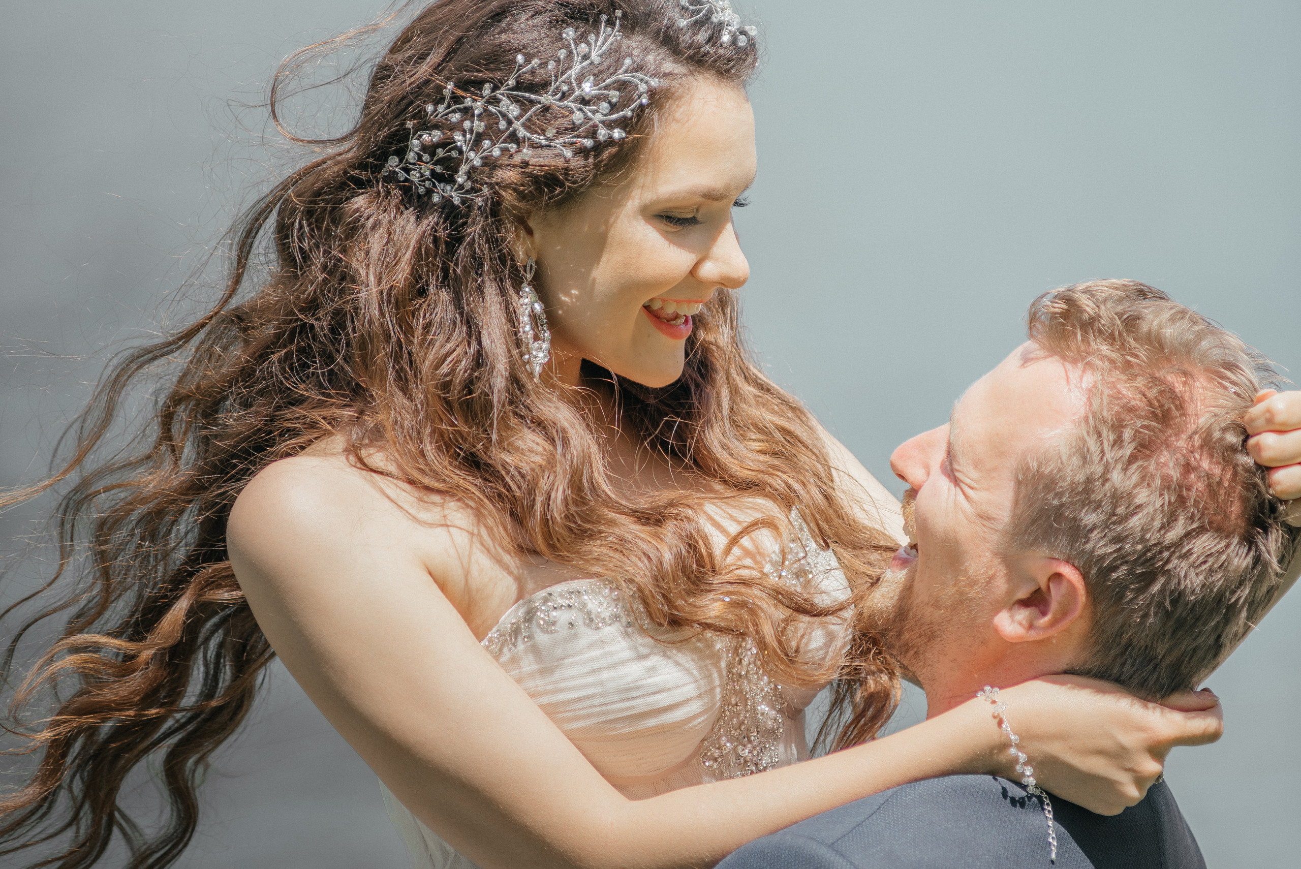 A happy wedding couple dancing and laughing. Bride and fiance
