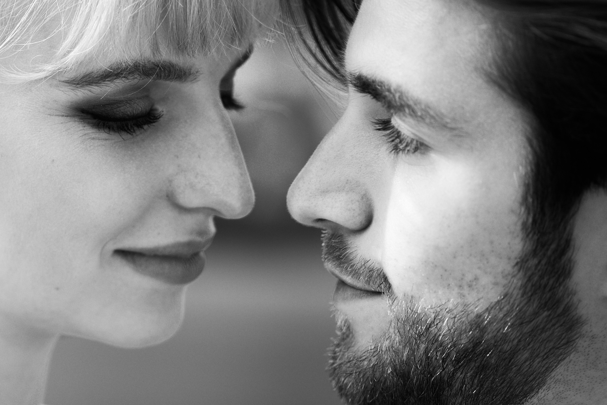 A romantic wedding couple is looking to each other. Black and white photography