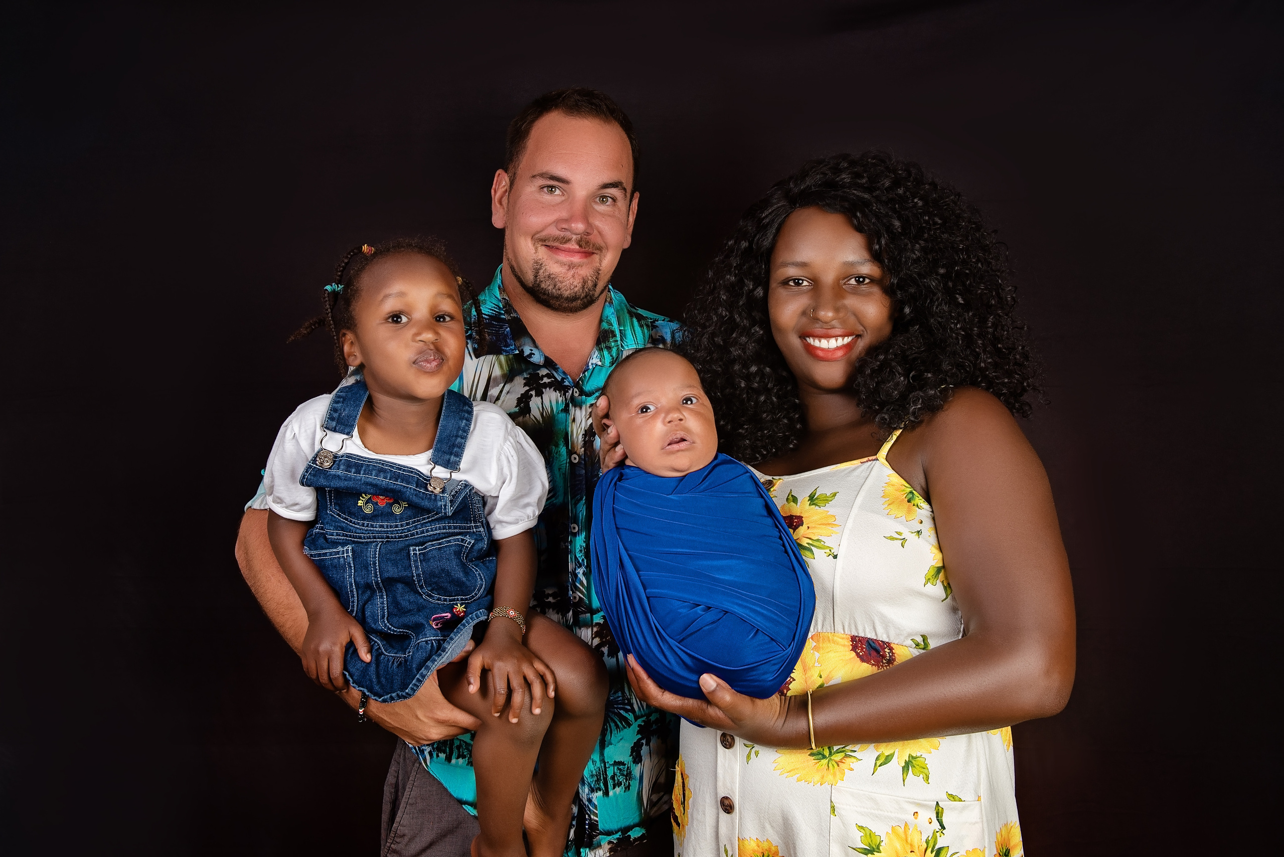 Amazing family from Africa mother father big sister newborn baby boy Nairobi Mombasa Kenya 
