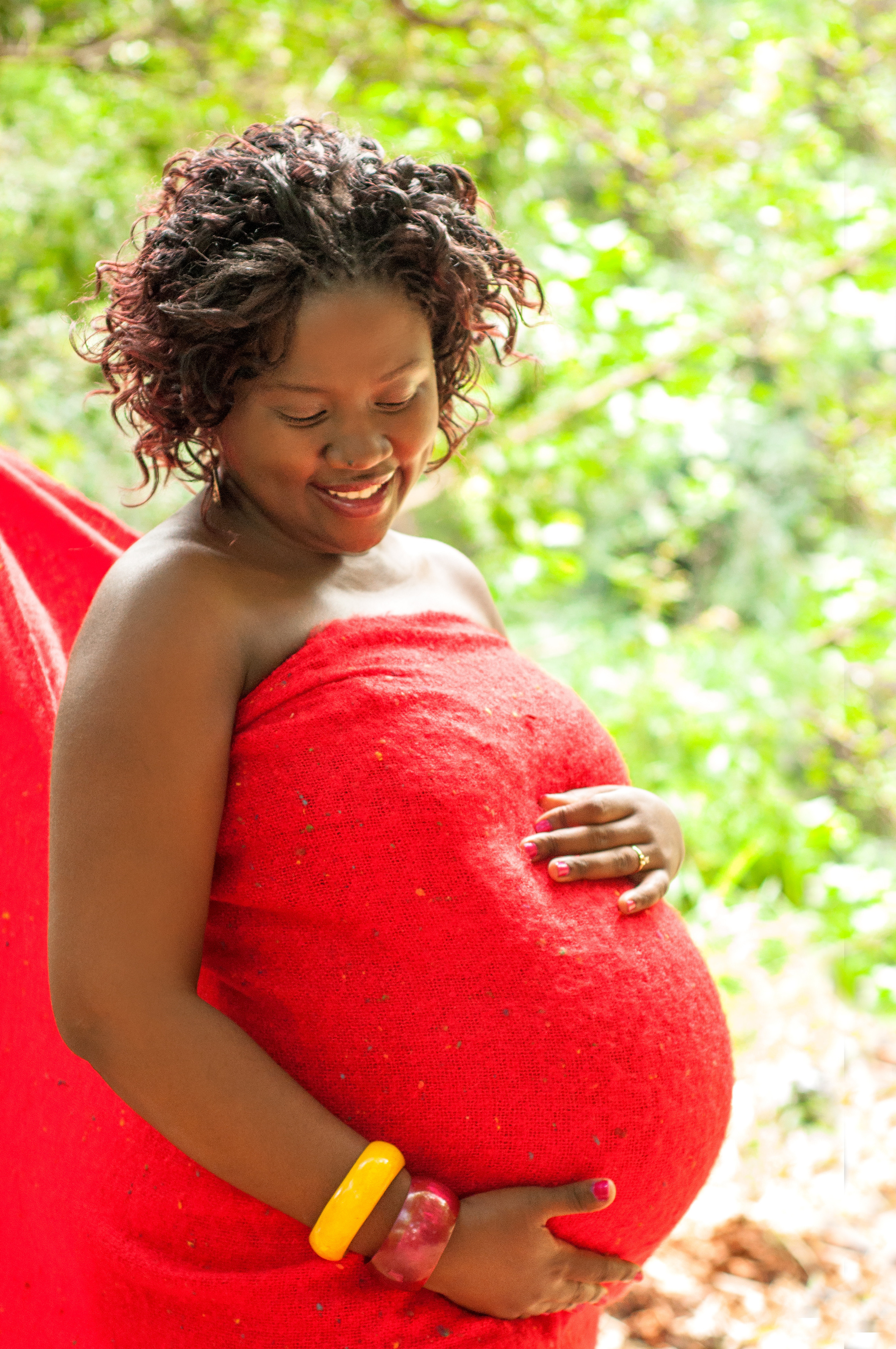 Beautiful black maternity lady in red photo shoot baby bump Nairobi Mombasa Kenya