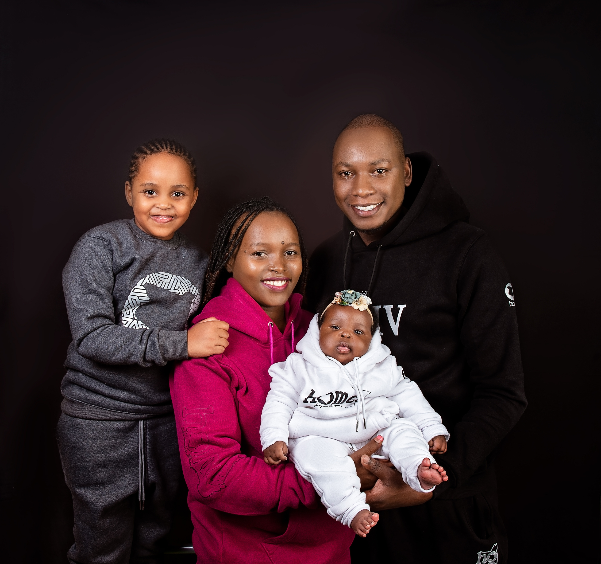 African Family father mother sister and 2 moths baby sibling photo shoot Nairobi Kenya