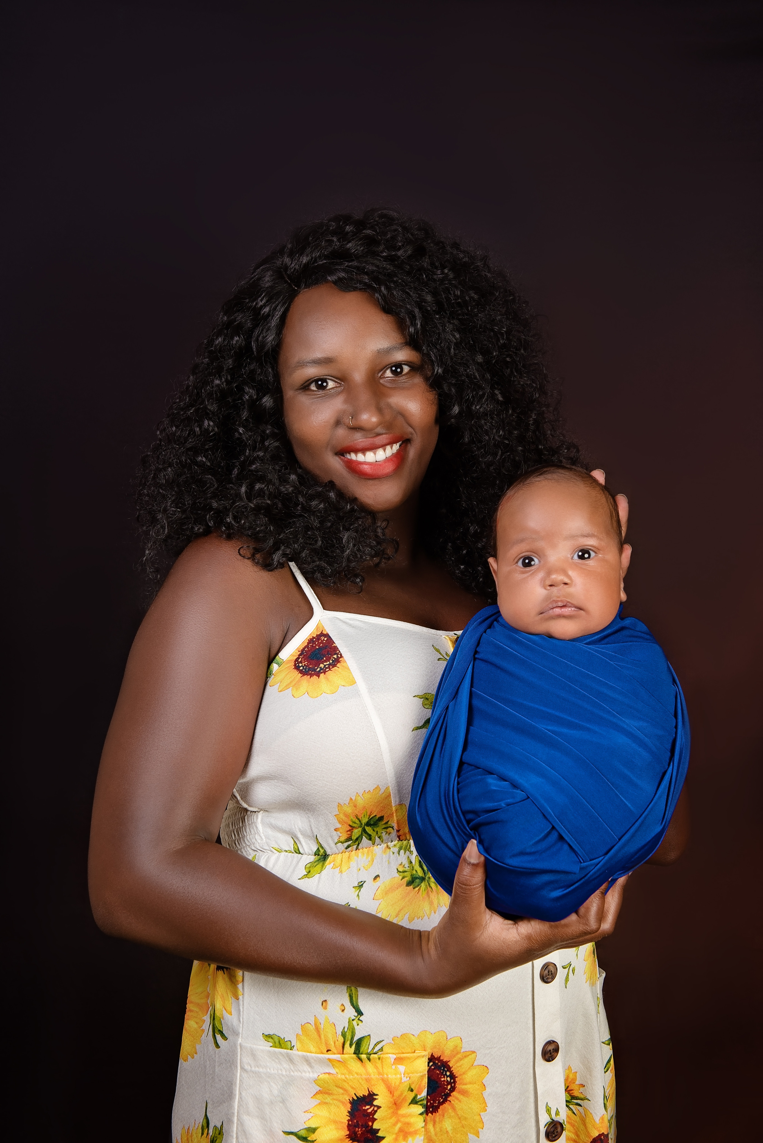 Beautiful black African woman mother with newborn baby boy photo shoot Nairobi Kenya 