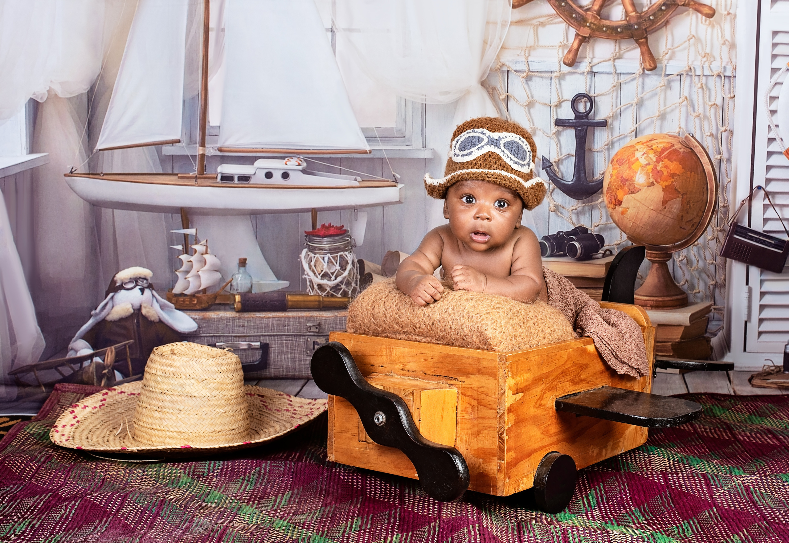 Handsome black baby boy photo shoot in the wooden plane newborn Nairobi Kenya