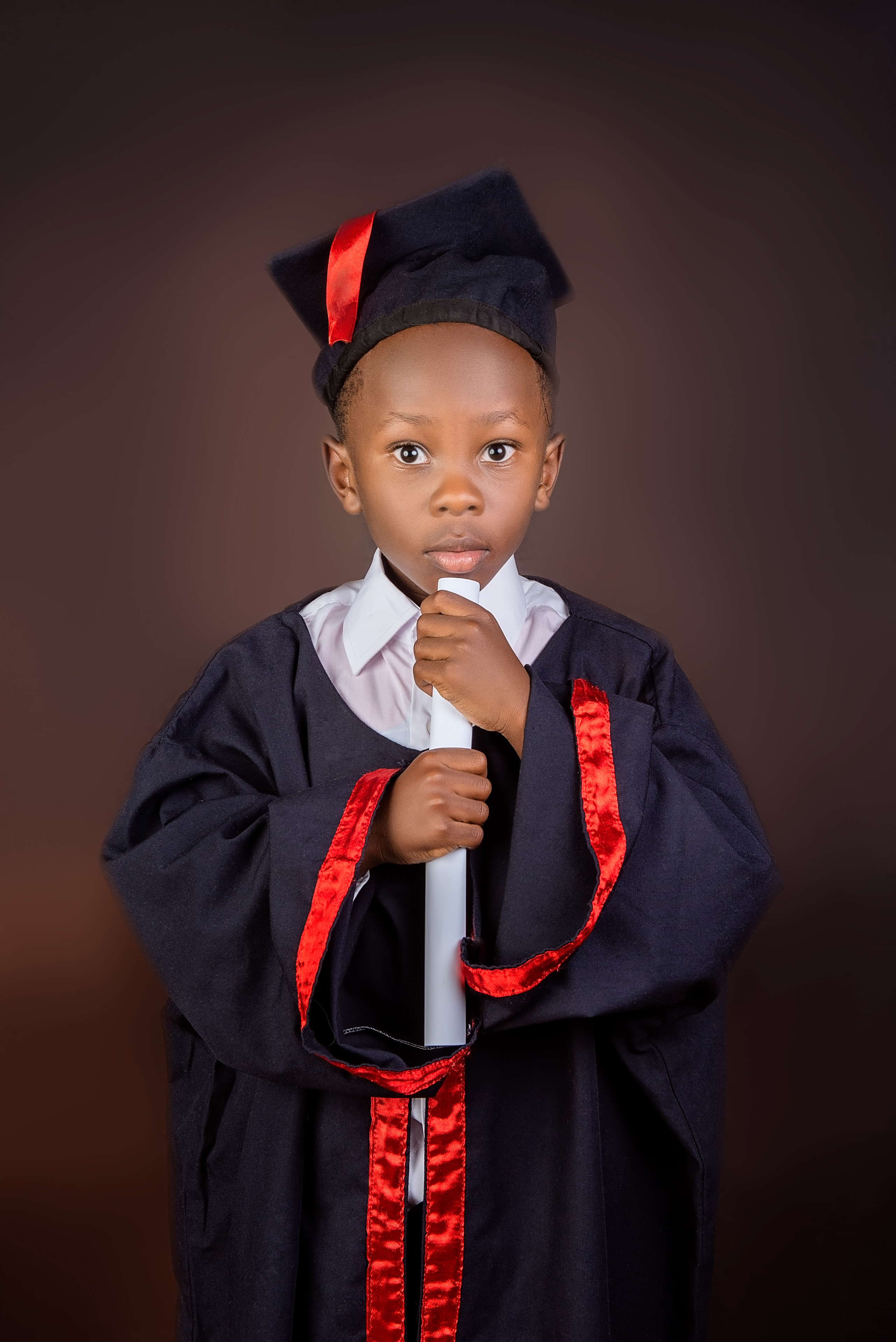 Kenyan graduation photo happy boy Mombasa Kenya 