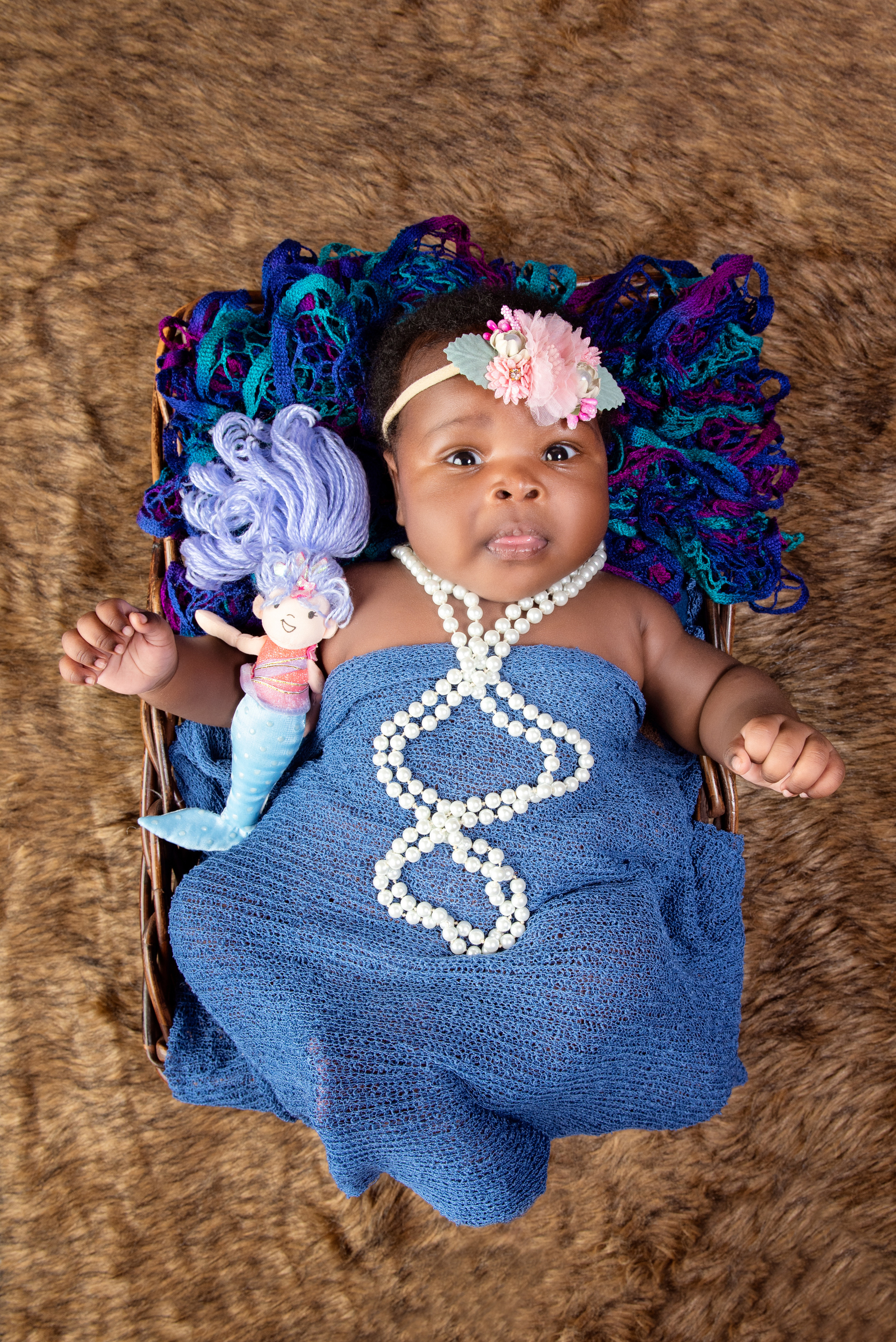 Beautiful African 2 months baby girl in the basket newborn photo shoot Mombasa Kenya  
