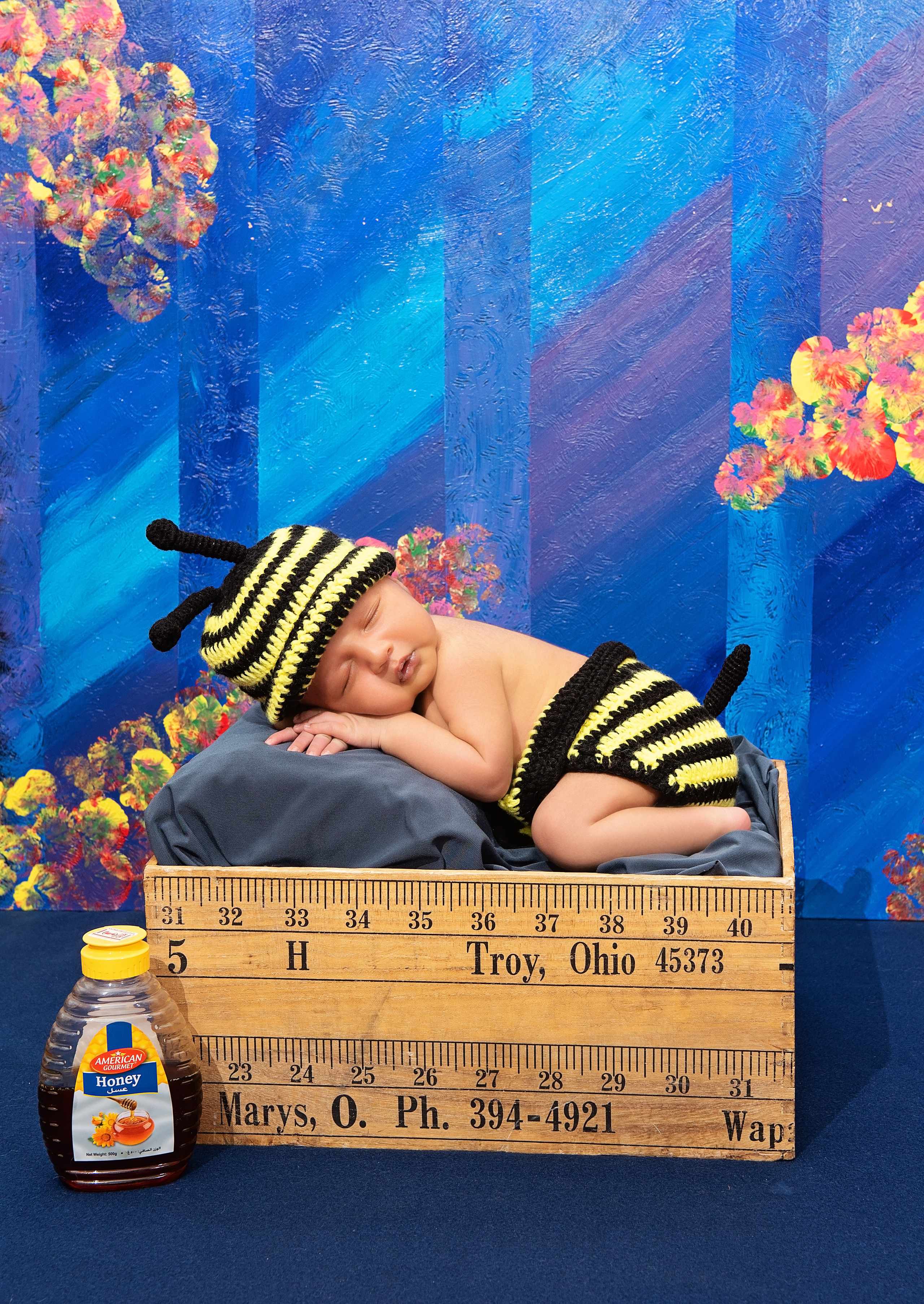 handsome Indian 1 month baby boy sleeping in crate photo shoot Mombasa Kenya