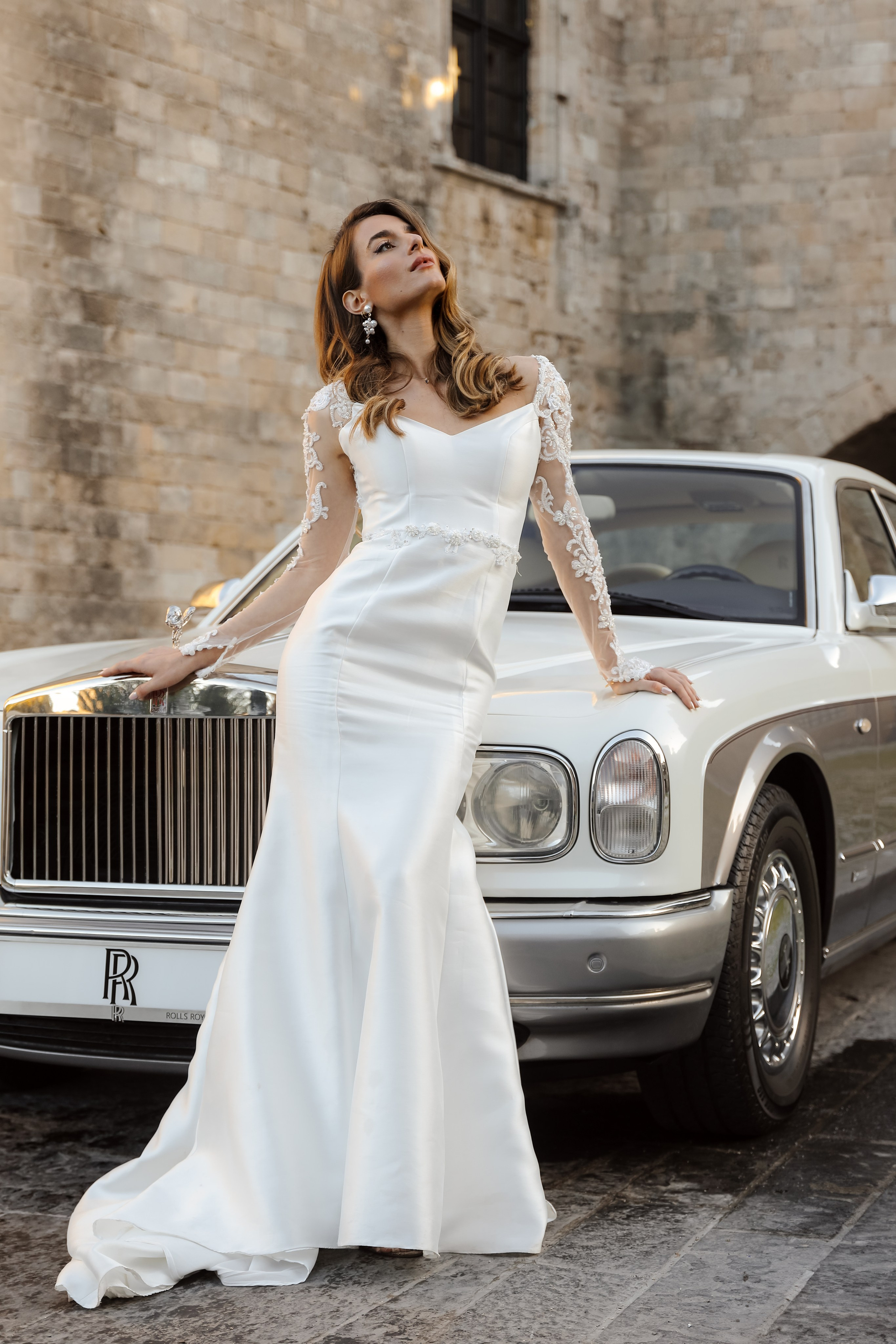 A bride next to Rolls Royce in old town of Rhodes island, Greece