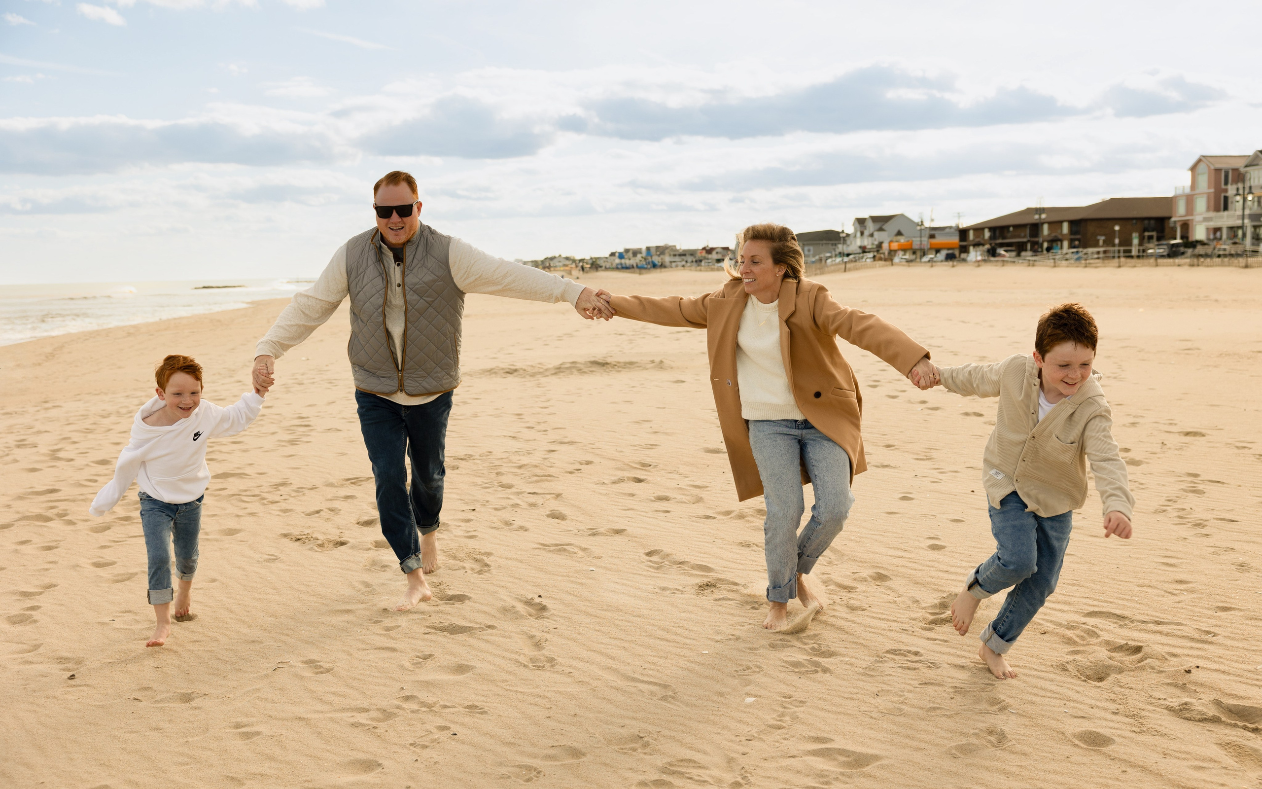 Sun, Sand, and Family Hugs. Family, lifestyle, and commercial photography in New York and New Jersey