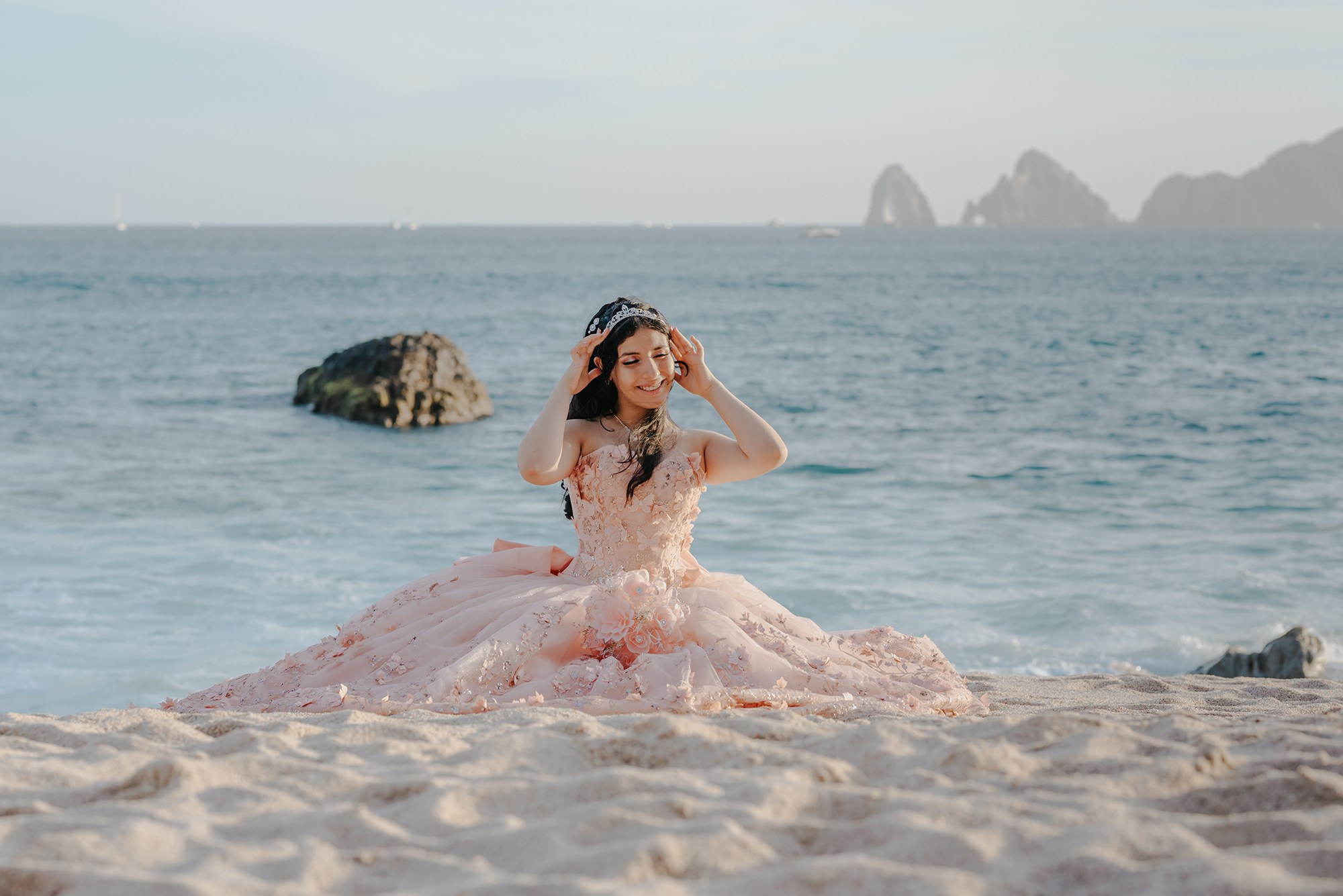 Beautiful quinceañera portrait on the beach with ocean views in Los Cabos, Baja California Sur