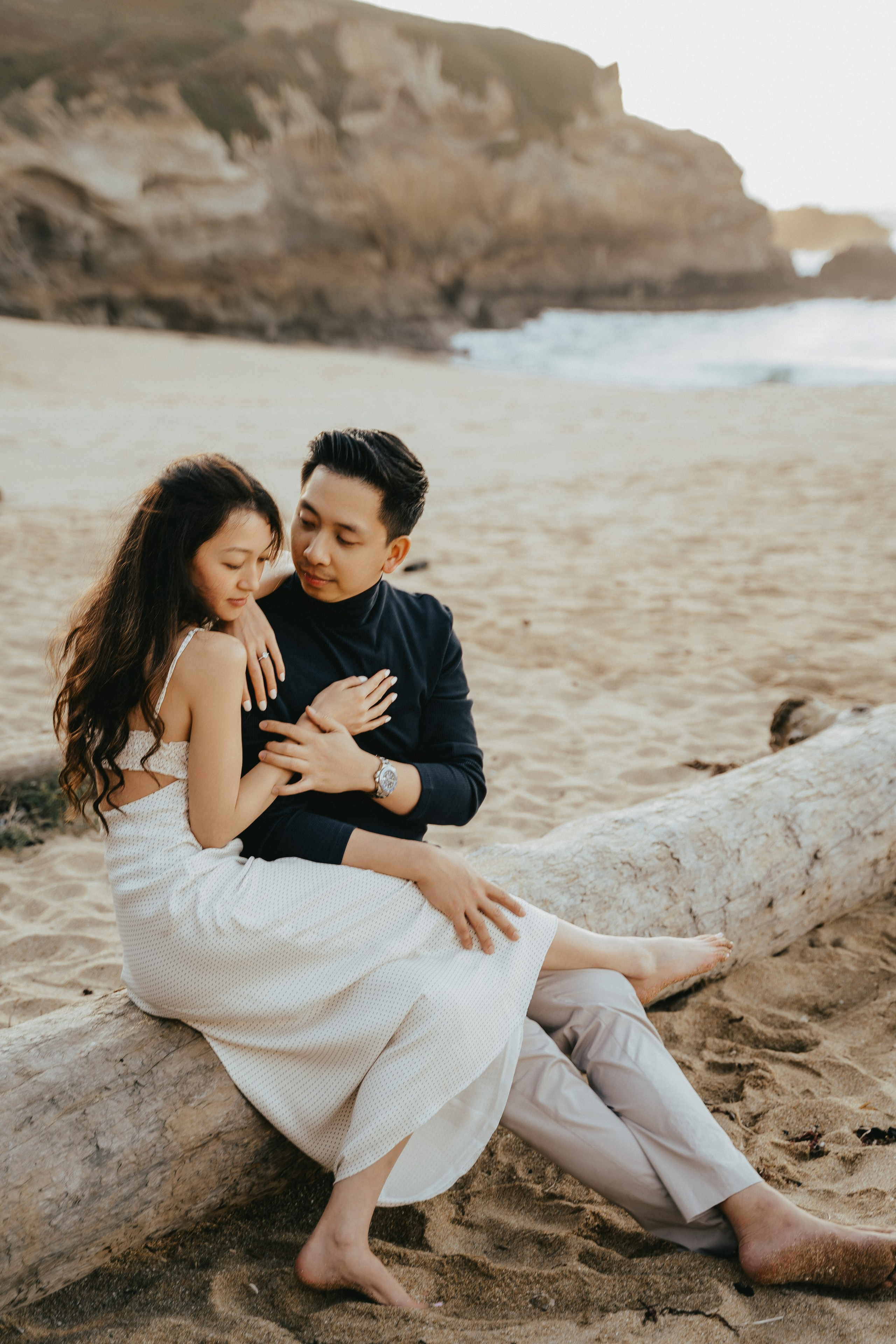 A photo shoot on the San Francisco beach at sunset. Engagement session. 