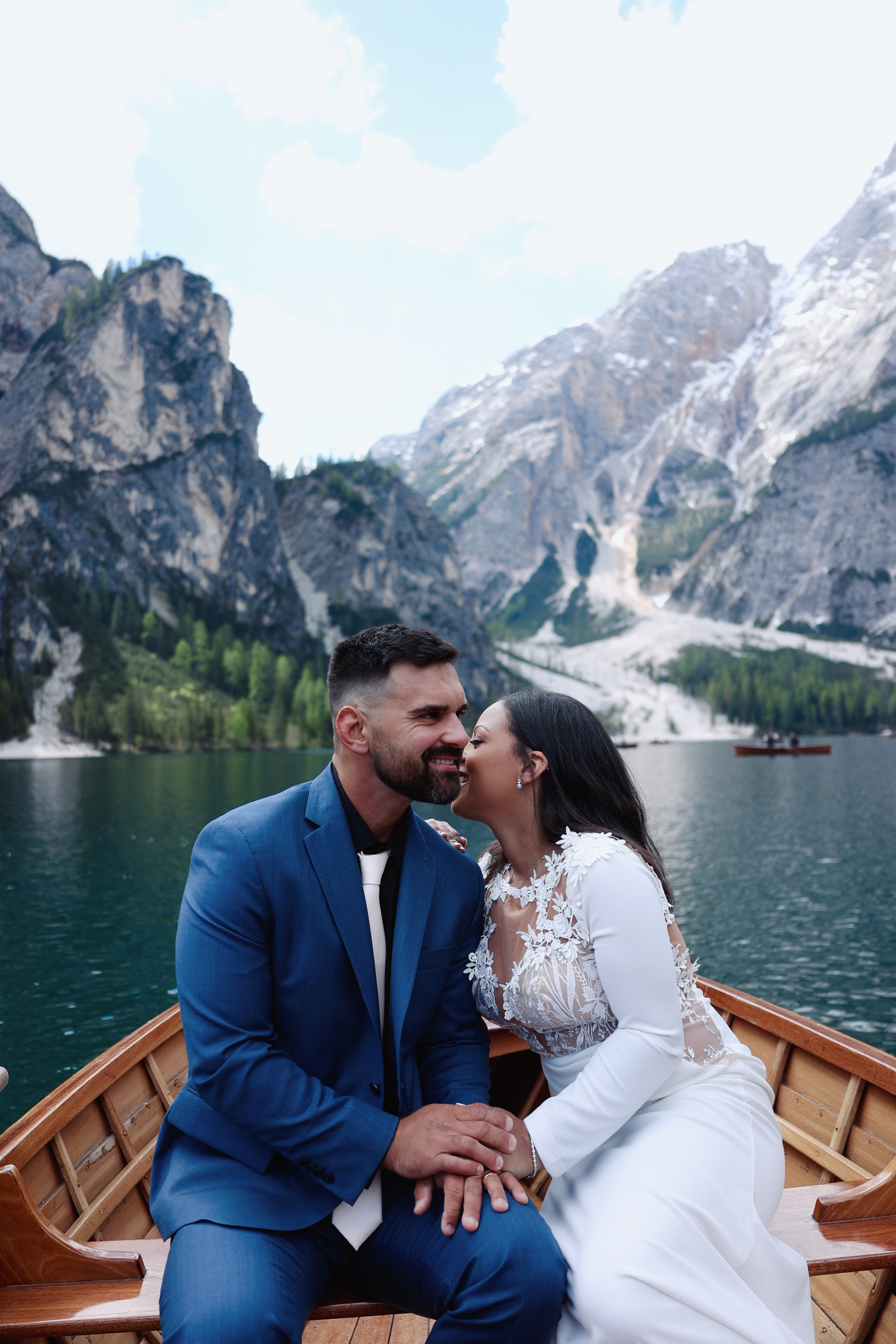 Couple exchanging vows on Lake Braies in the Dolomites