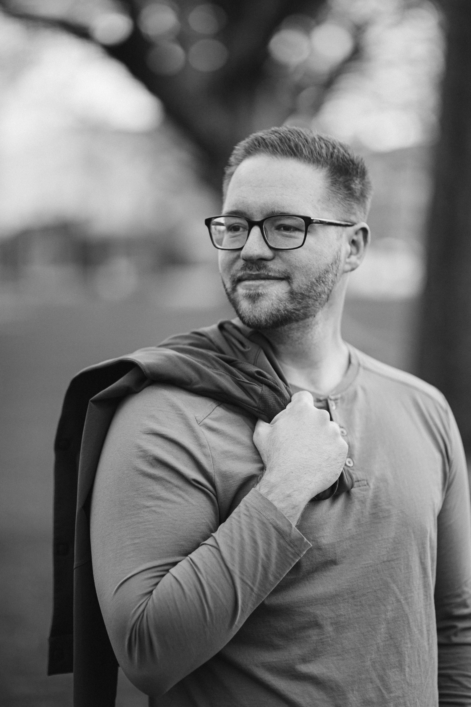 Black-and-white portrait of man with glasses