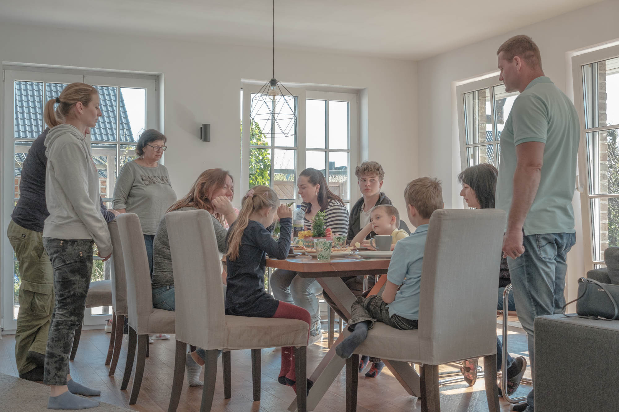 Olga and Lilya visit their Volkov family friends. After praying for Ukraine, they drink tea, April, 2022