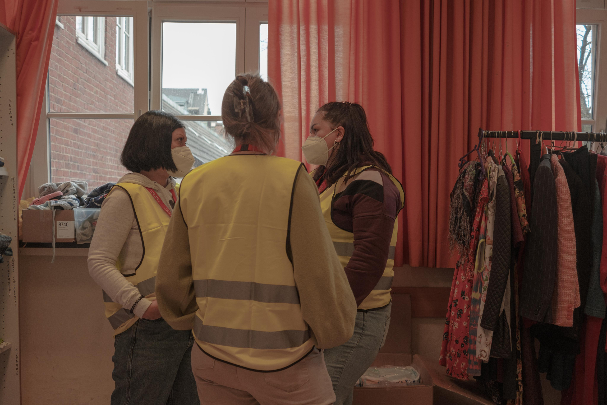 Lilia is talking with other Ukrainians during their charity work in Caritas, April, 2022