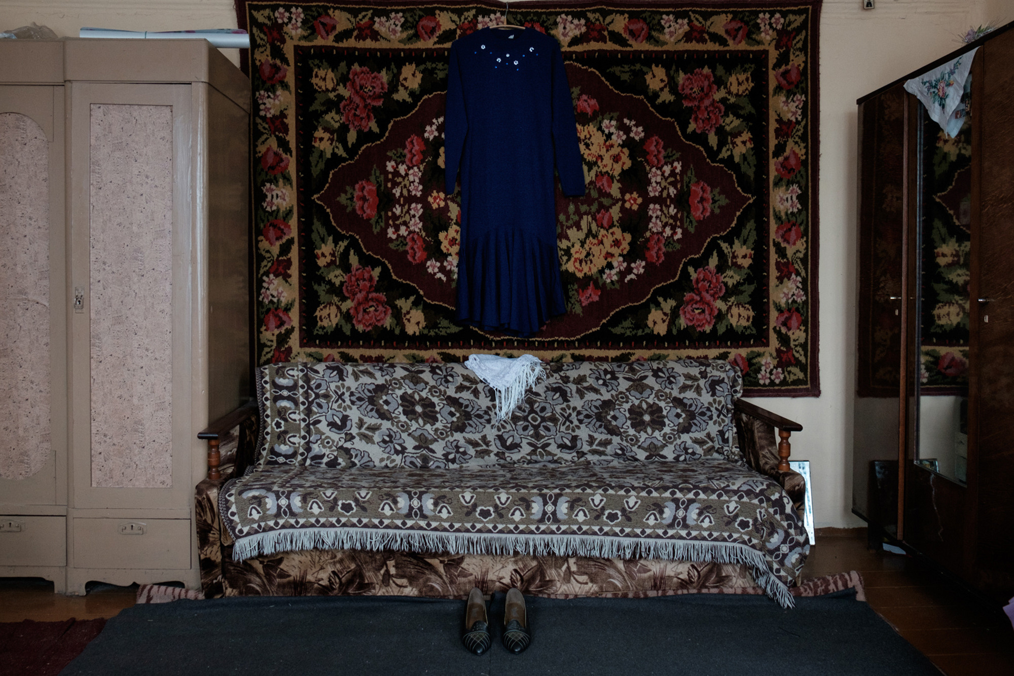 The blue dress, white scarf and sensible shoes that Vera has set aside to clothe her at her funeral, ‘so that in the next world she might be comfortable and beautiful’