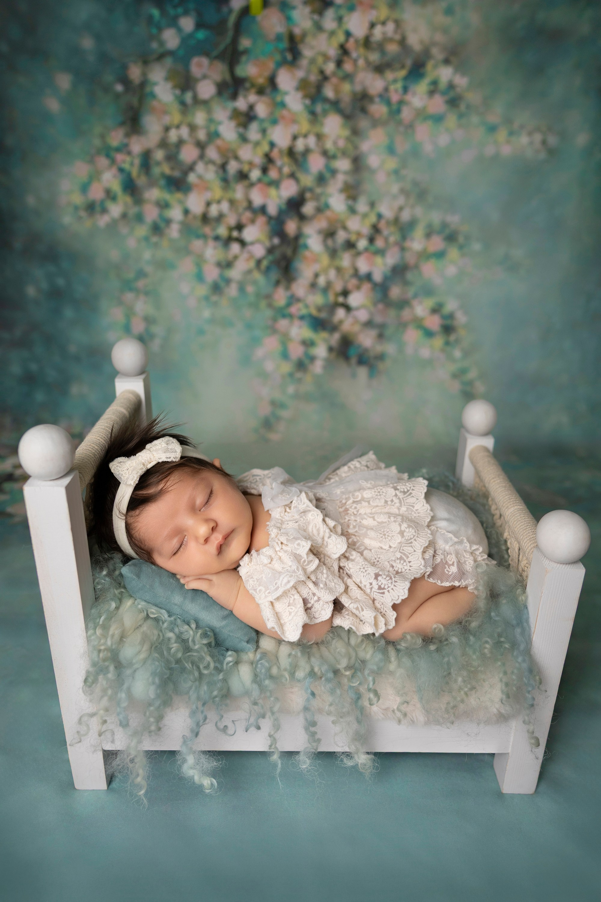 baby in a bed, green colors