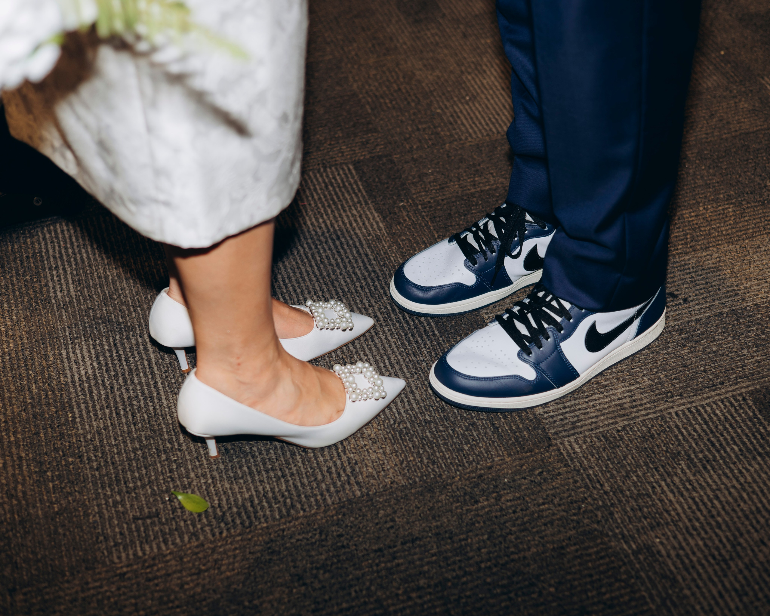 Bridal shoes next to groom shoes on ceremony day in Chicago
