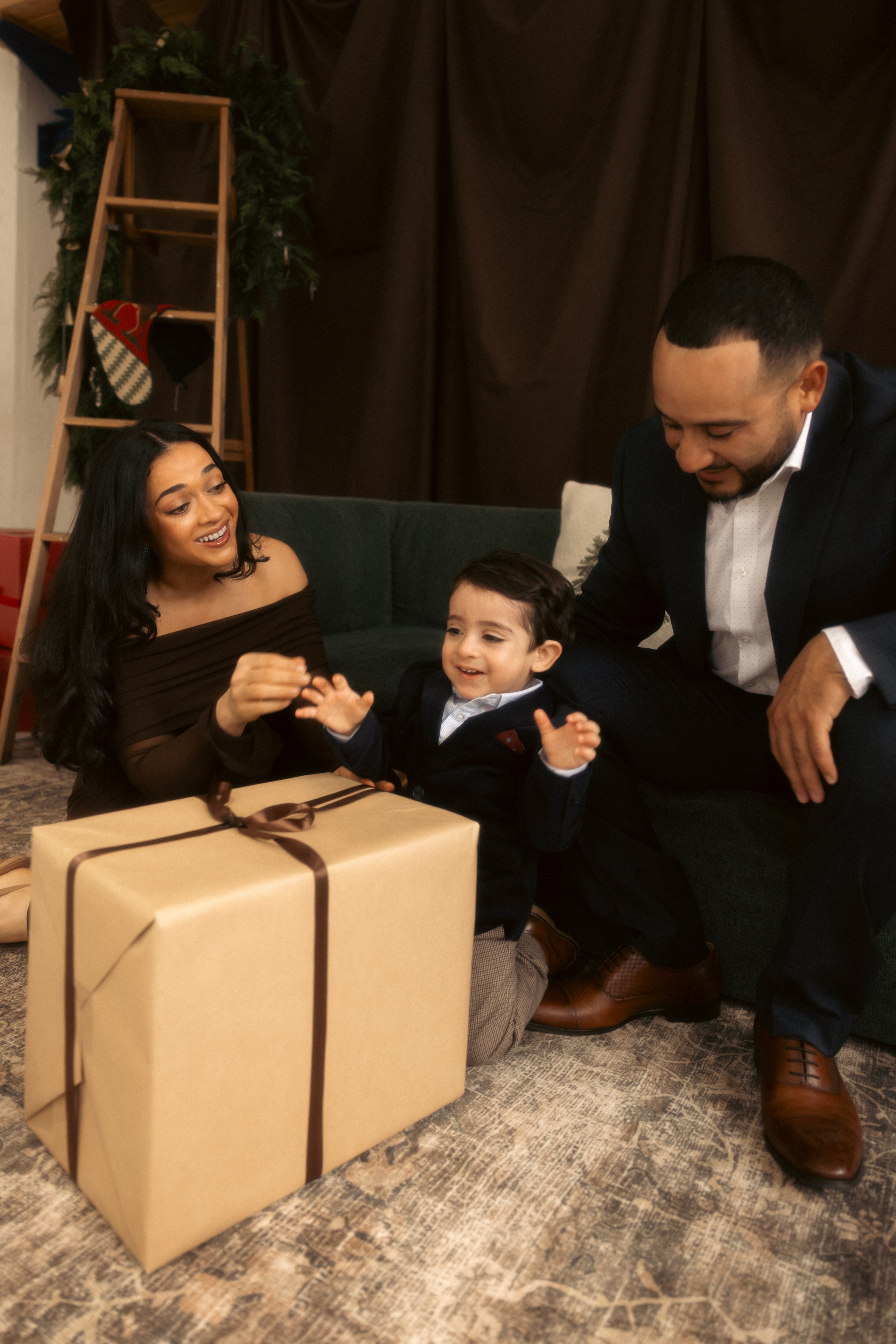 Baby reaching for ornaments during Christmas mini session