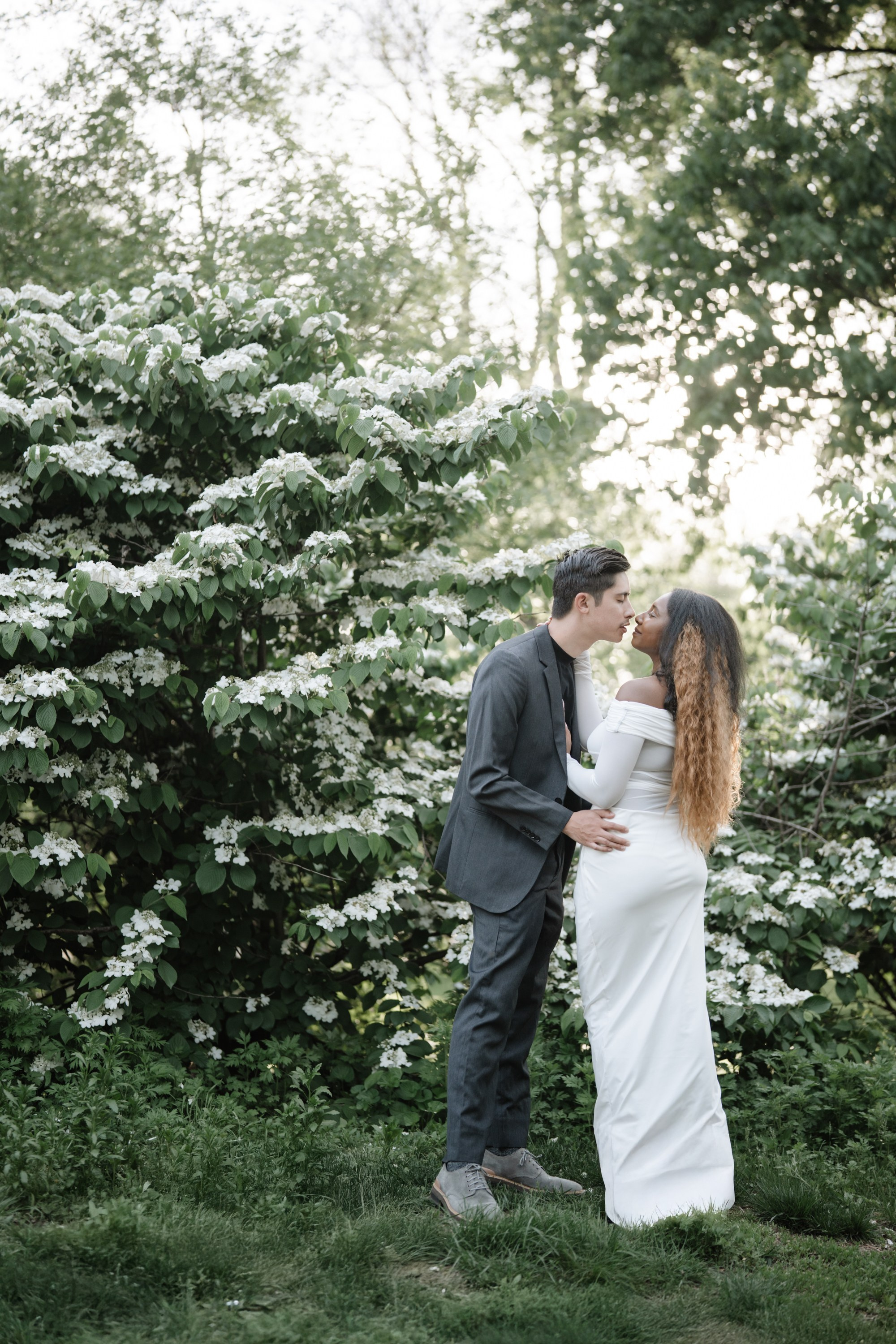 Engagement photo shoot in Central Park in spring. Portrait and wedding photographer in New York