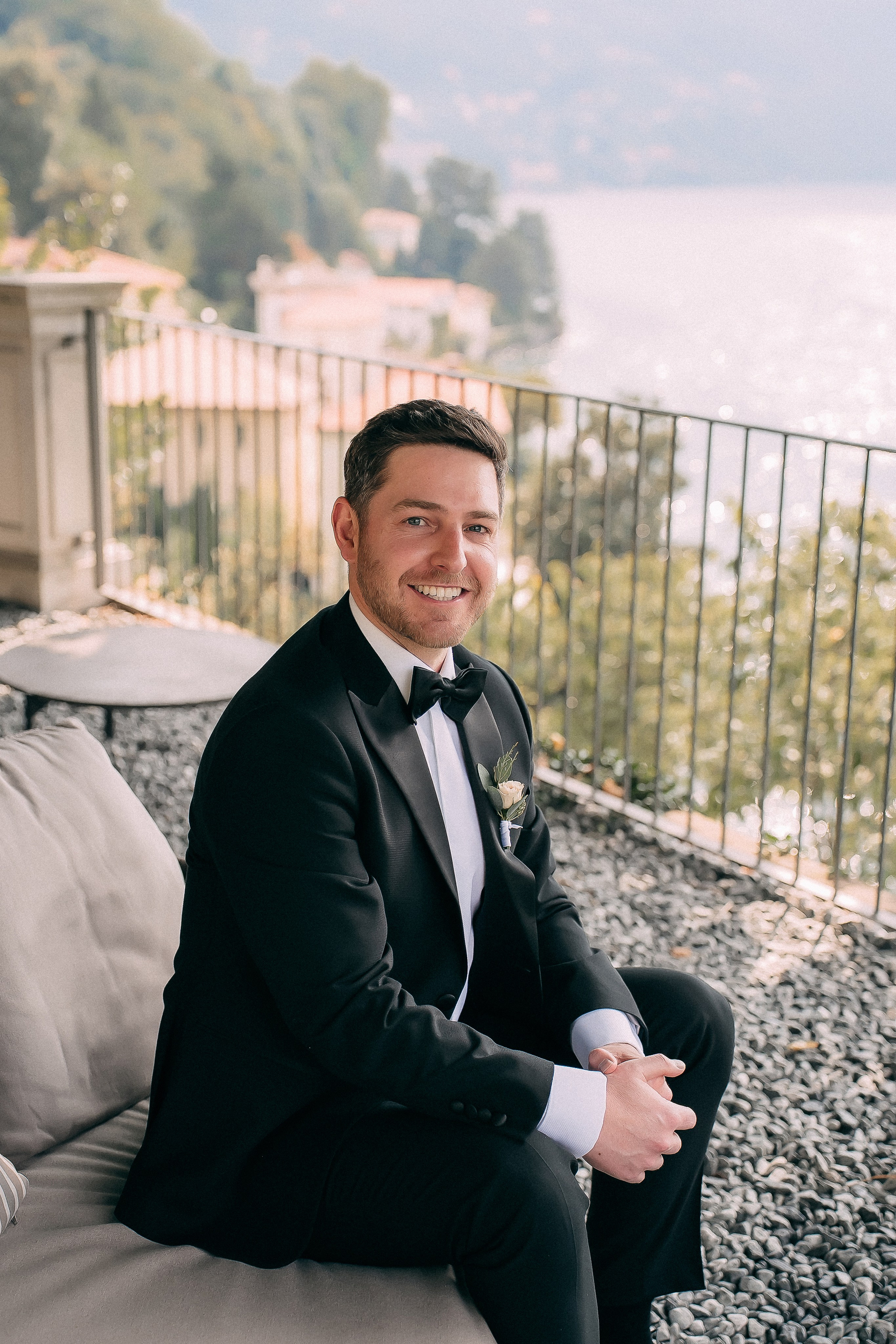 Groom with family on the terrace at Villa Lario, Lake Como, Italy