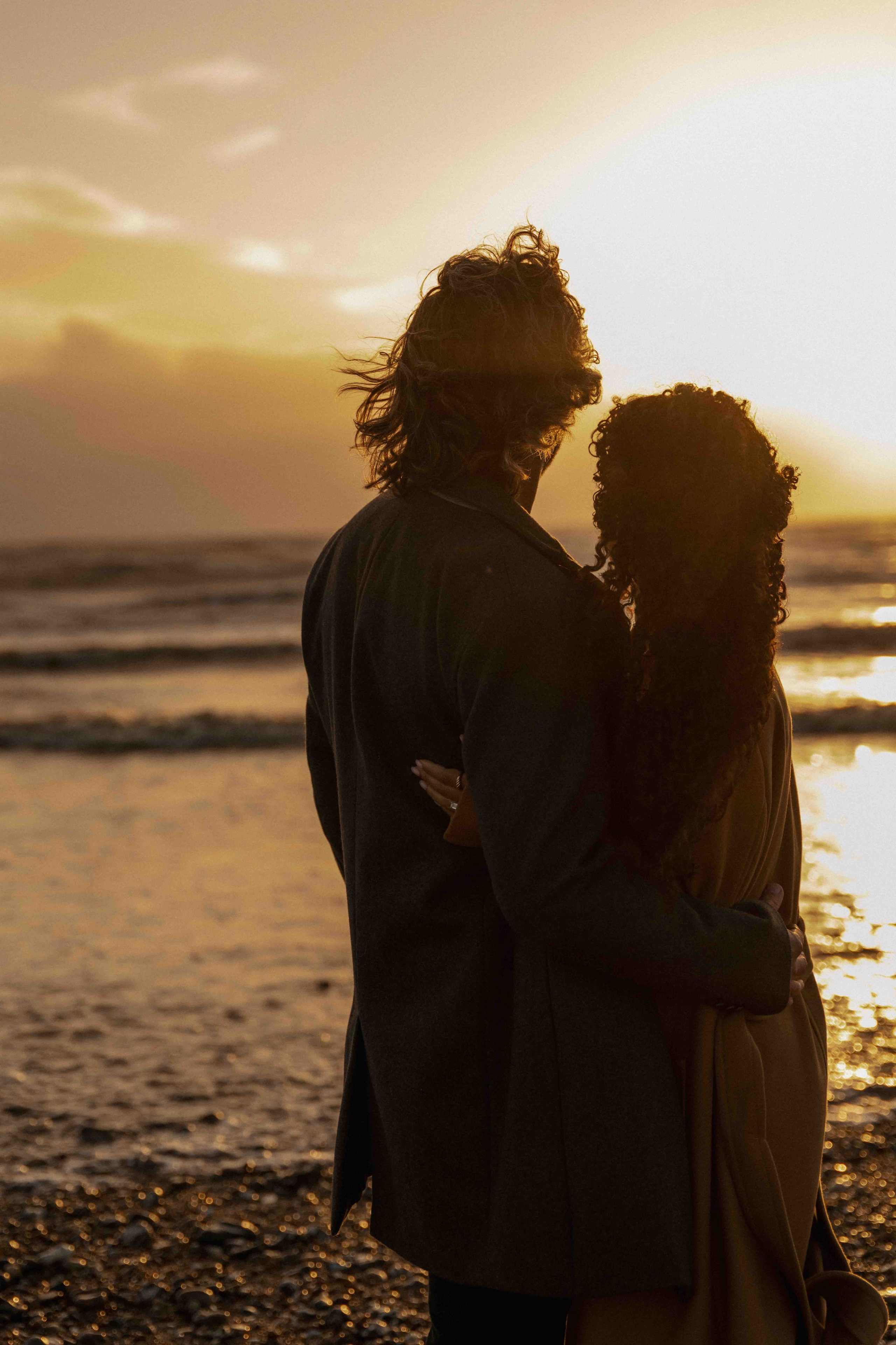 silhouette couple sunset seven sisters beach engagement photos uk