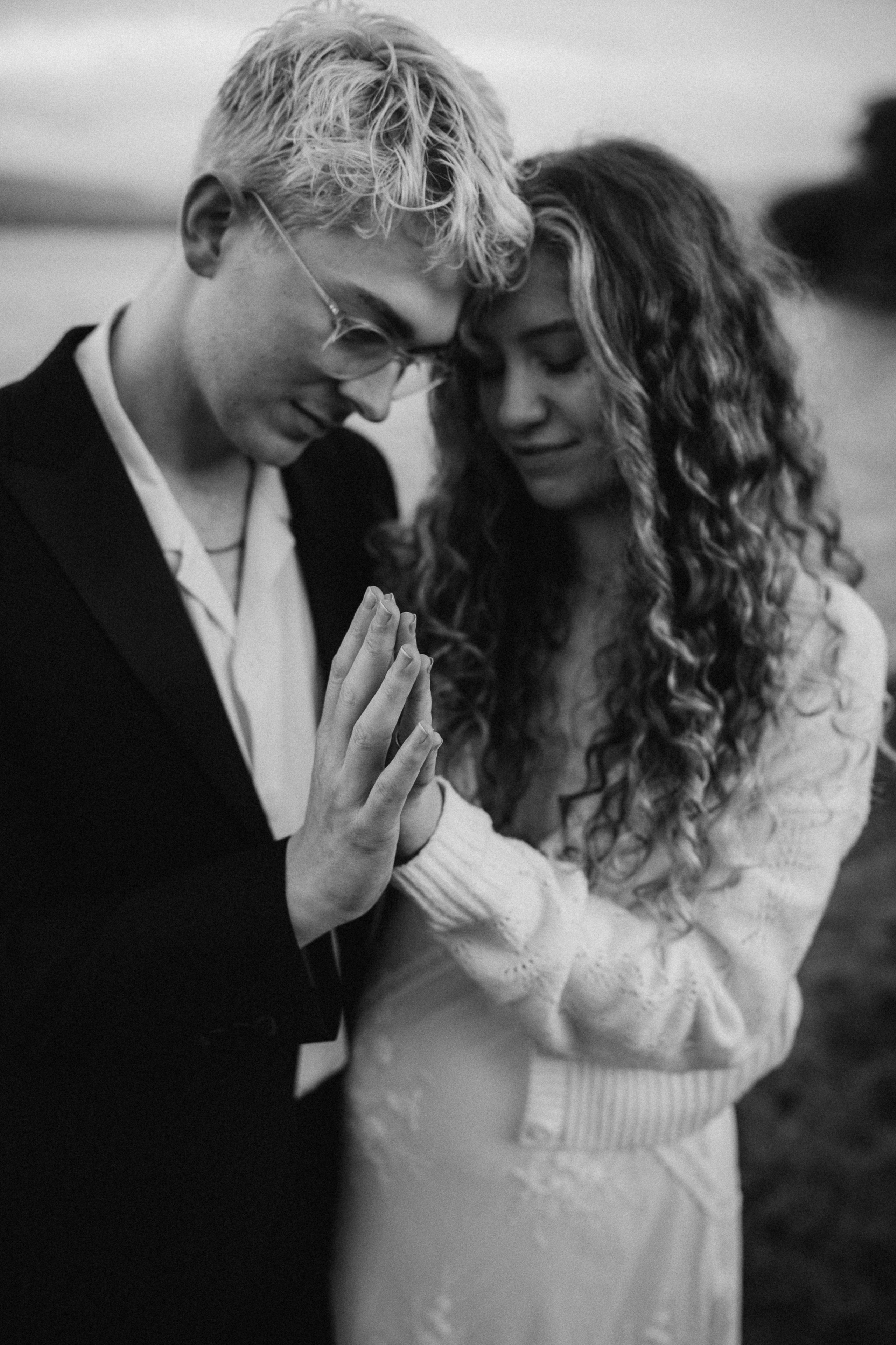 man and woman hold hands