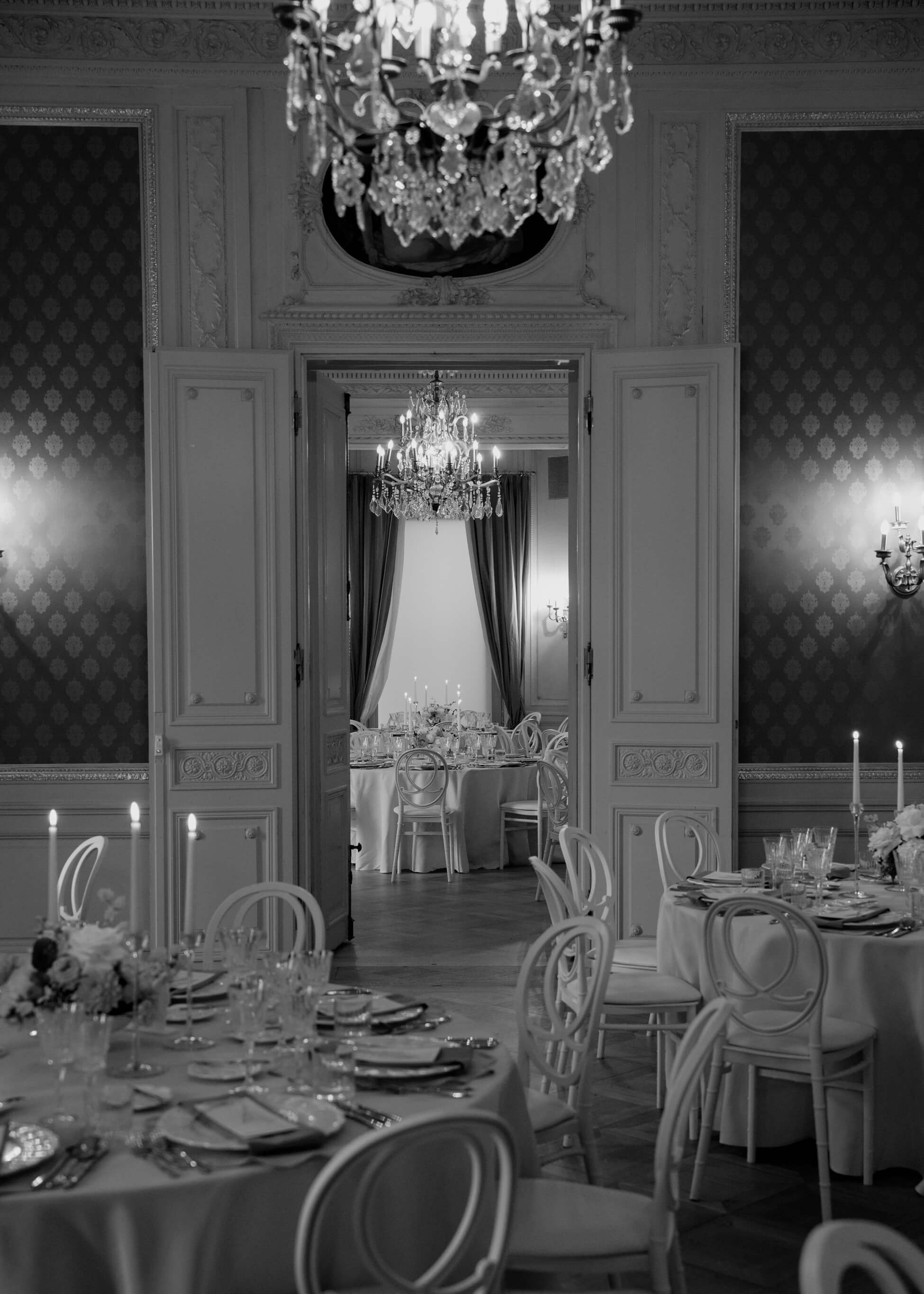 Elegant ballroom at Villa Rothschild with chandeliers and white chairs set for luxury wedding reception Frankfurt