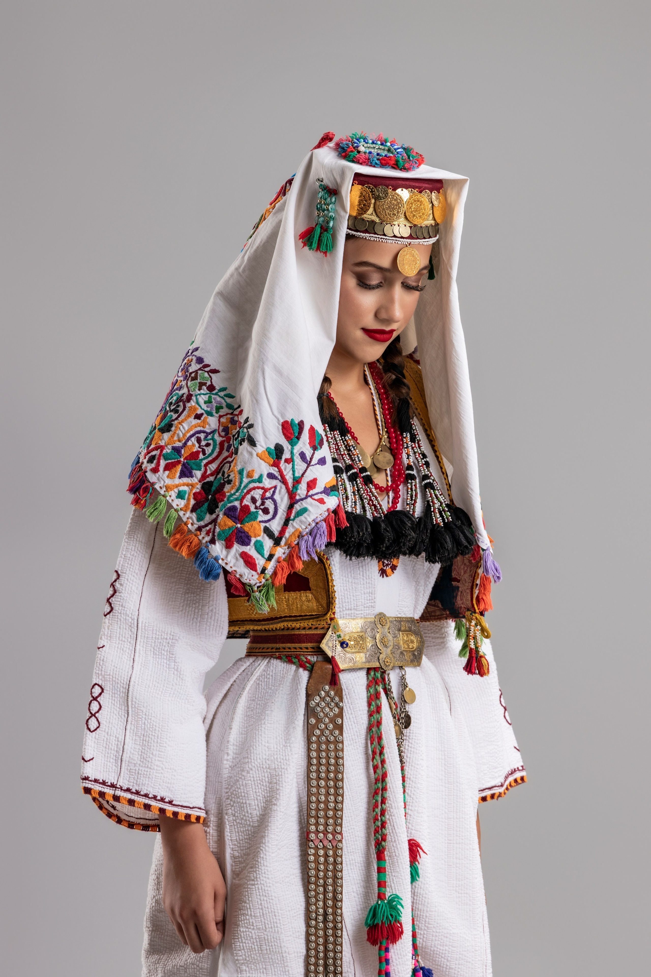 Studio portrait photography of traditional folk costumes from Bosnia and Herzegovina featuring authentic cultural clothing, embroidery, jewelry and handcrafted garments, photographed by Namir Čomaga. The images highlight the richness, craftsmanship and cultural heritage of Bosnian traditional costumes through carefully lit studio portraits.