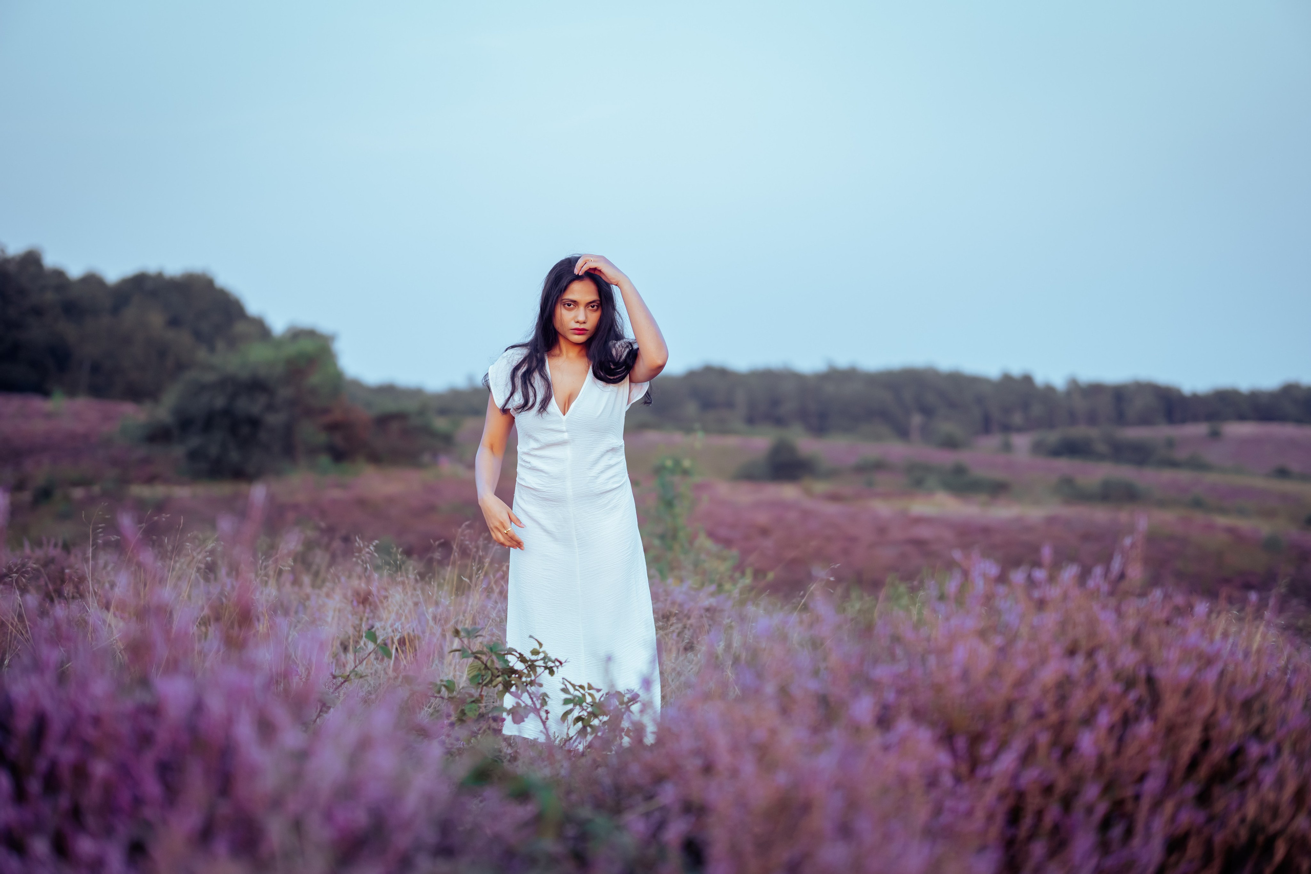 woman standing in veluwe heather fields netherlands