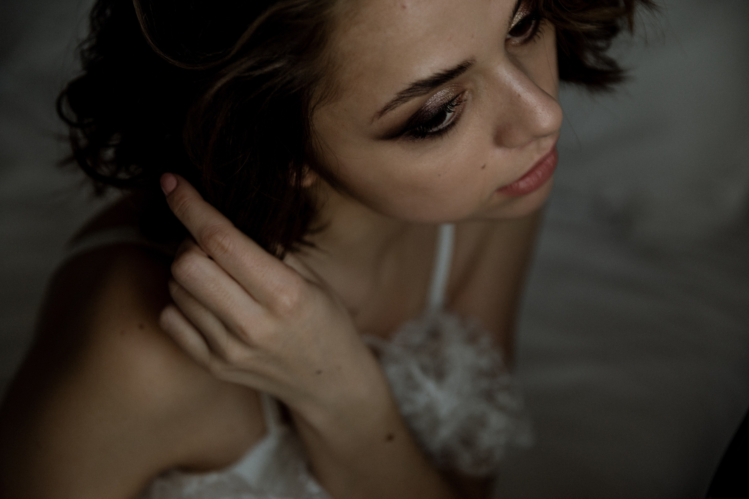Wedding couple photoshoot on the beach with waves and sunset, destination wedding photography Spain