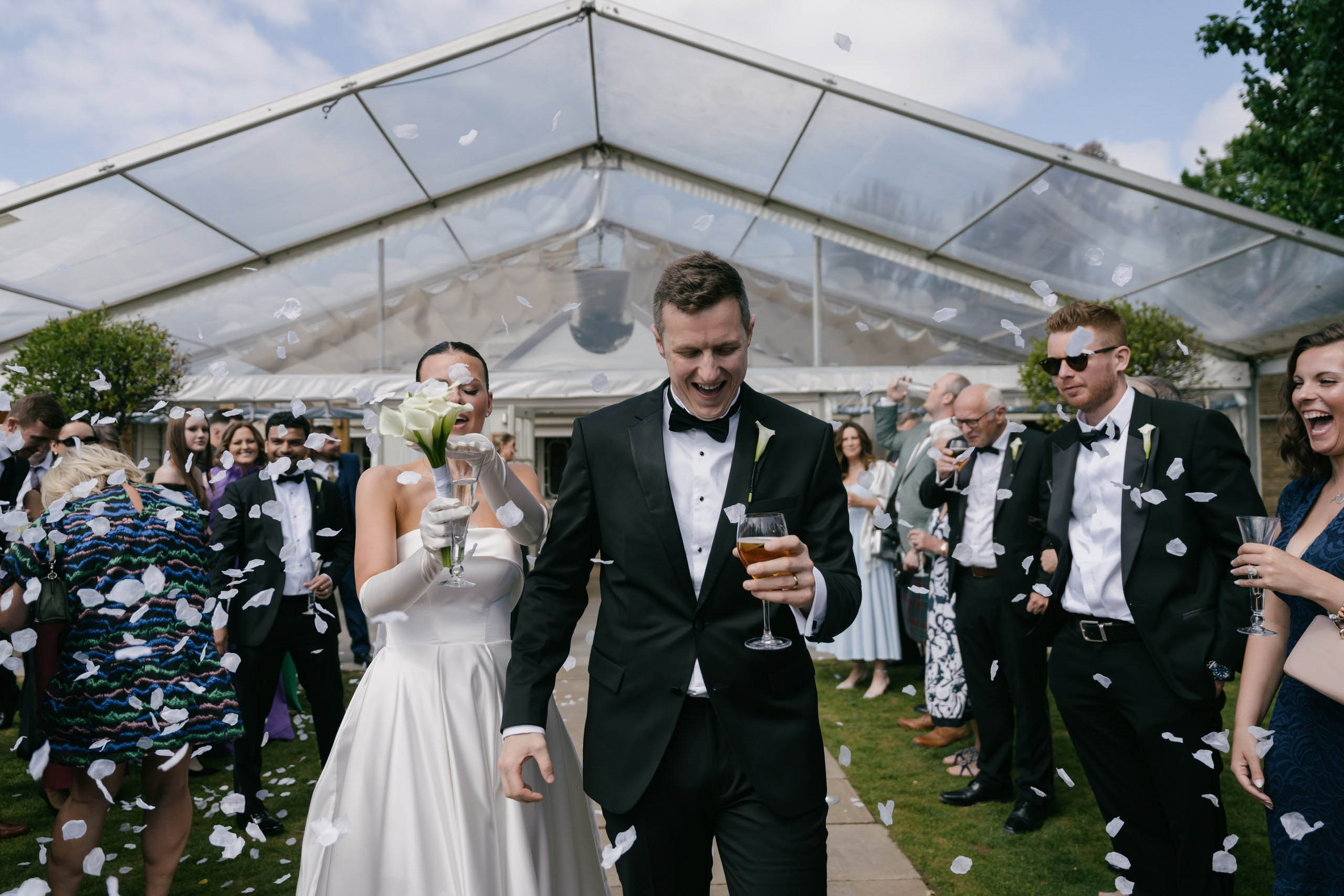 Confetti moment outside wedding ceremony Friern Manor Essex