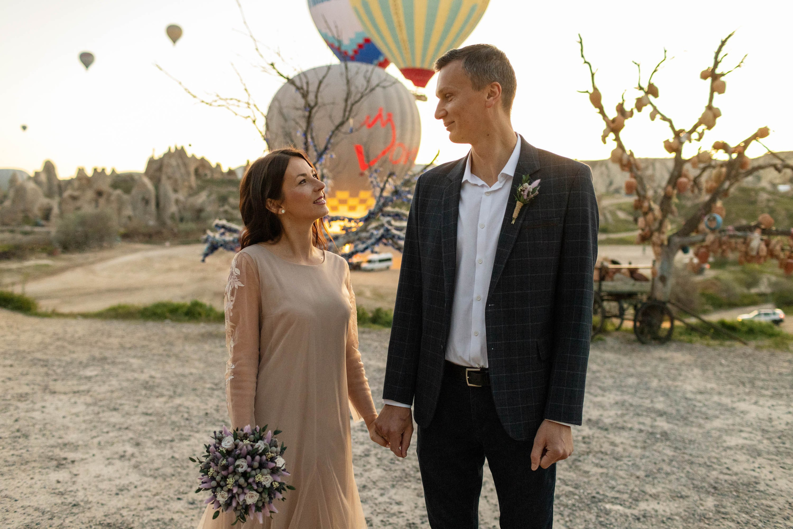 Magical Wedding Photoshoot in Cappadocia: Balloons, Caves, and Valleys. Julia Ganch I Fashion Wedding Photography I Cappadocia Turkey