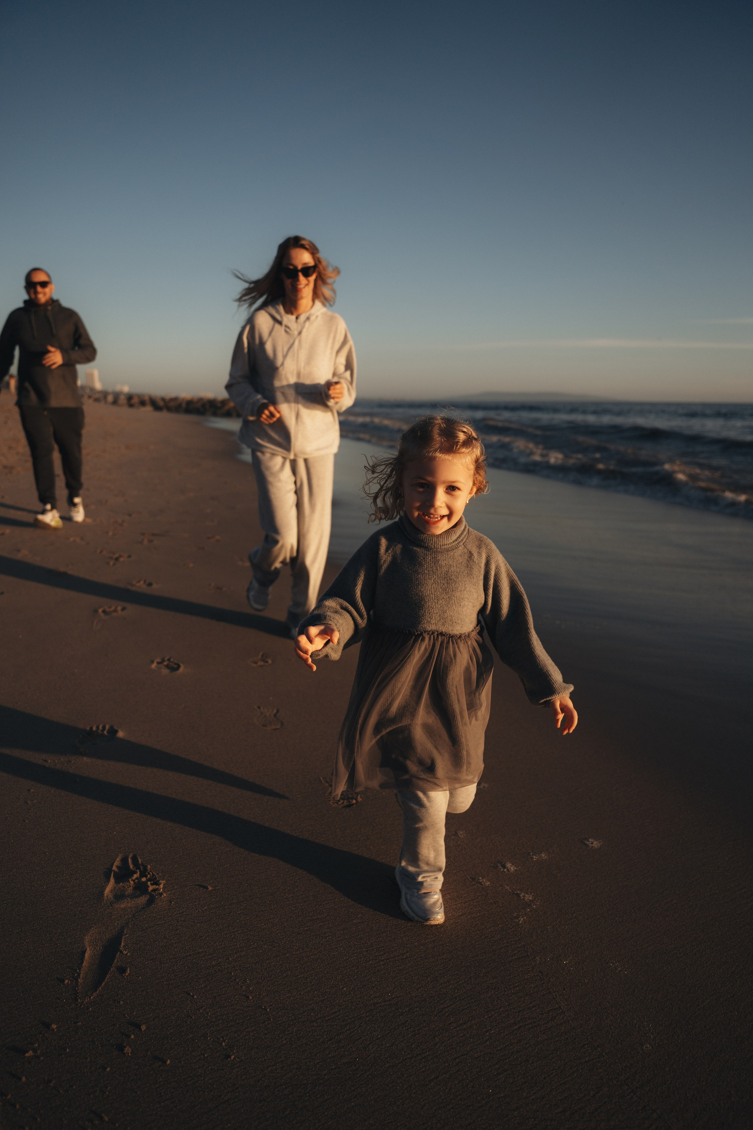 Family photoshoot. Family photoshoot outside. Beach photoshoot. Family holiday photoshoot. Sunset photoshoot