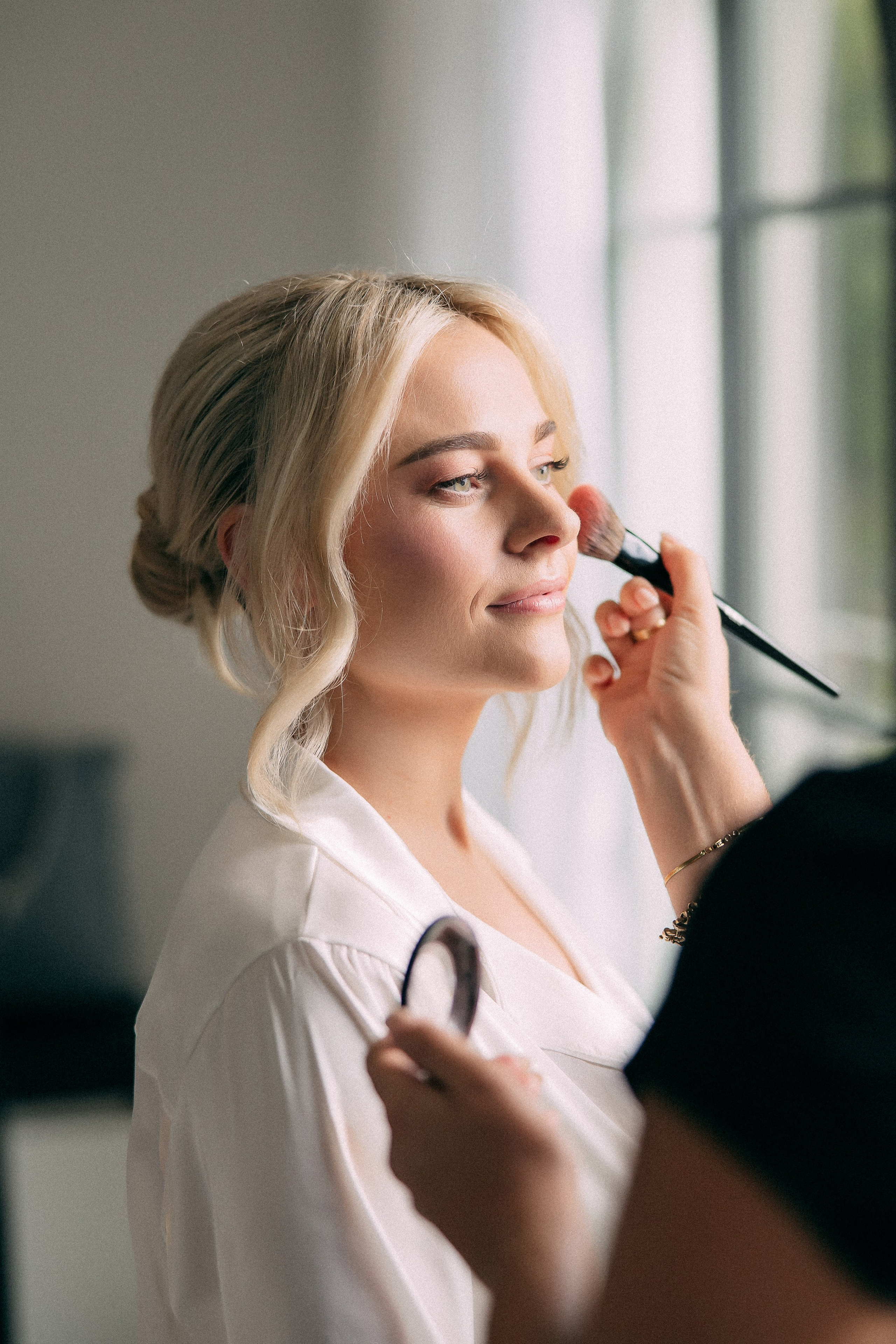 Bride having makeup applied before her Lake Como wedding day in Italy