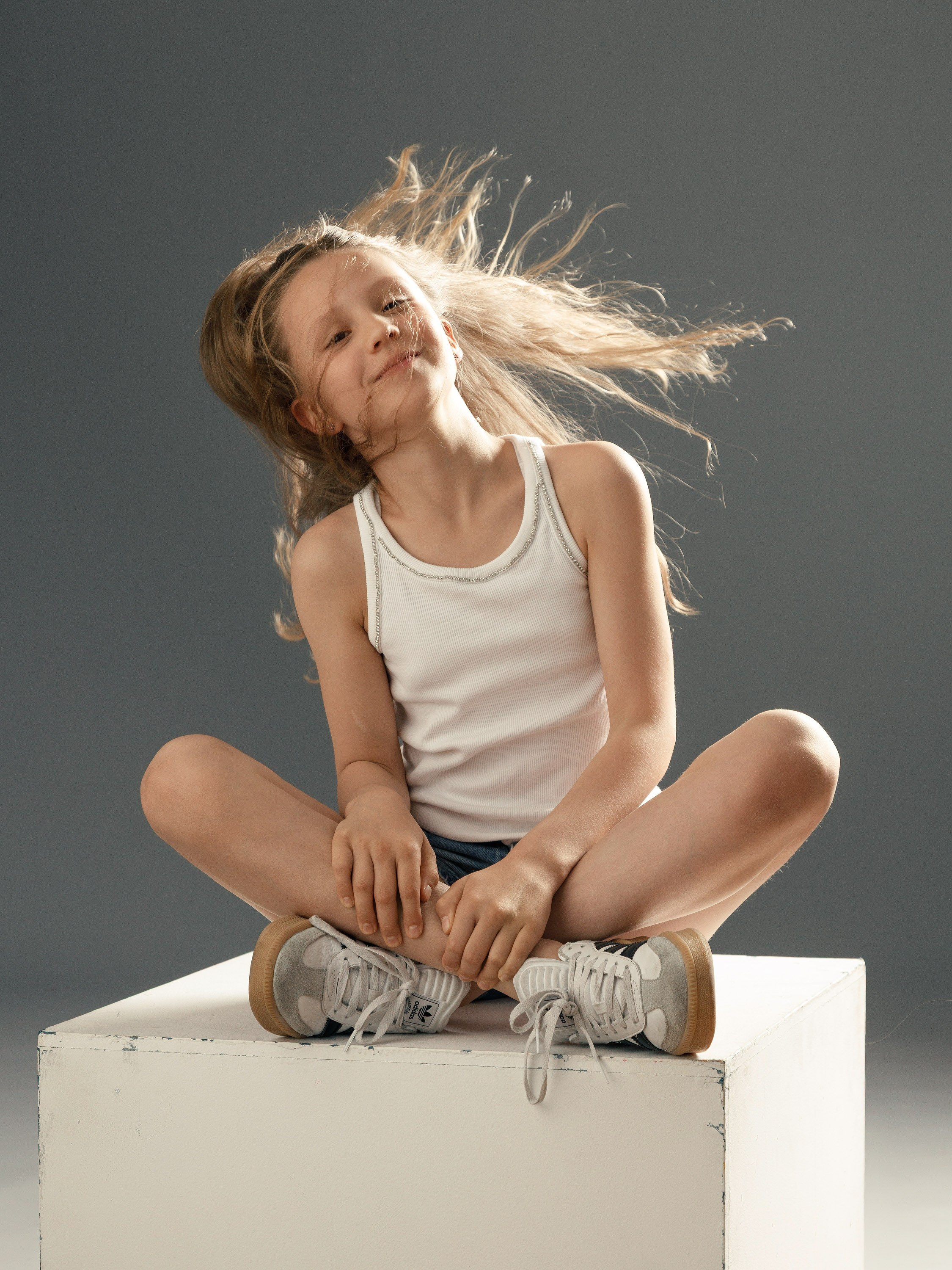 girl in a studio portrait session, windswept hair, black and white, London