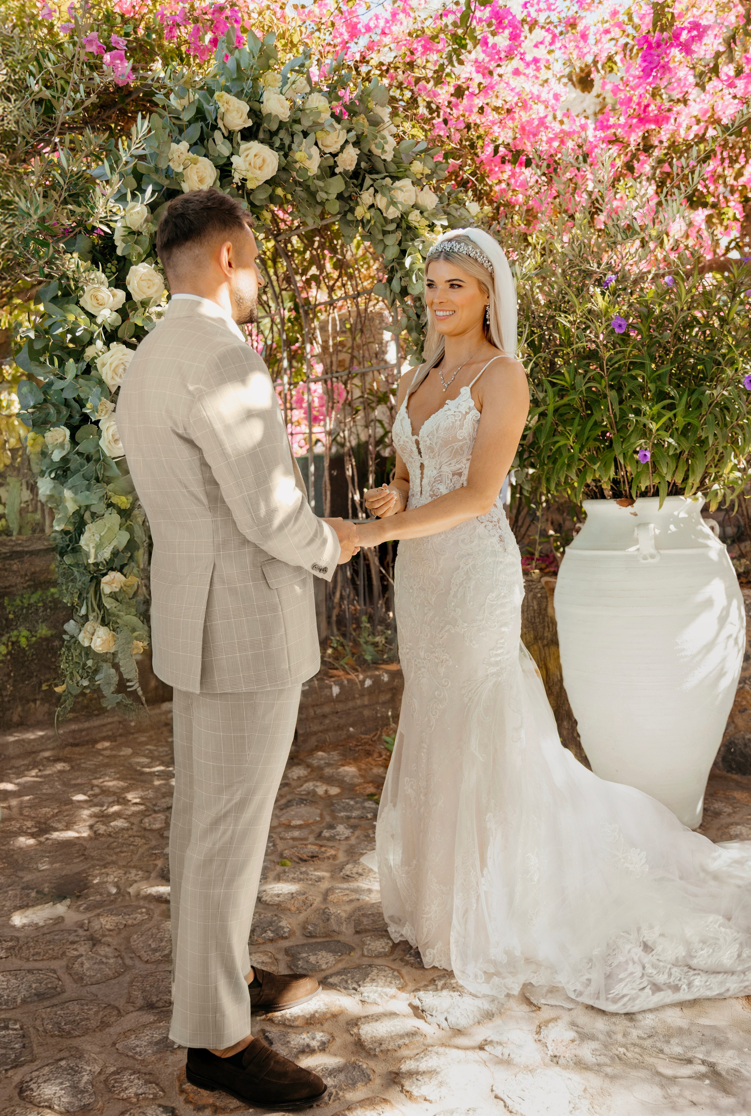Romantic wedding ceremony in Lindos, Greece, with the couple holding hands, Wedding photographer, Rhodes