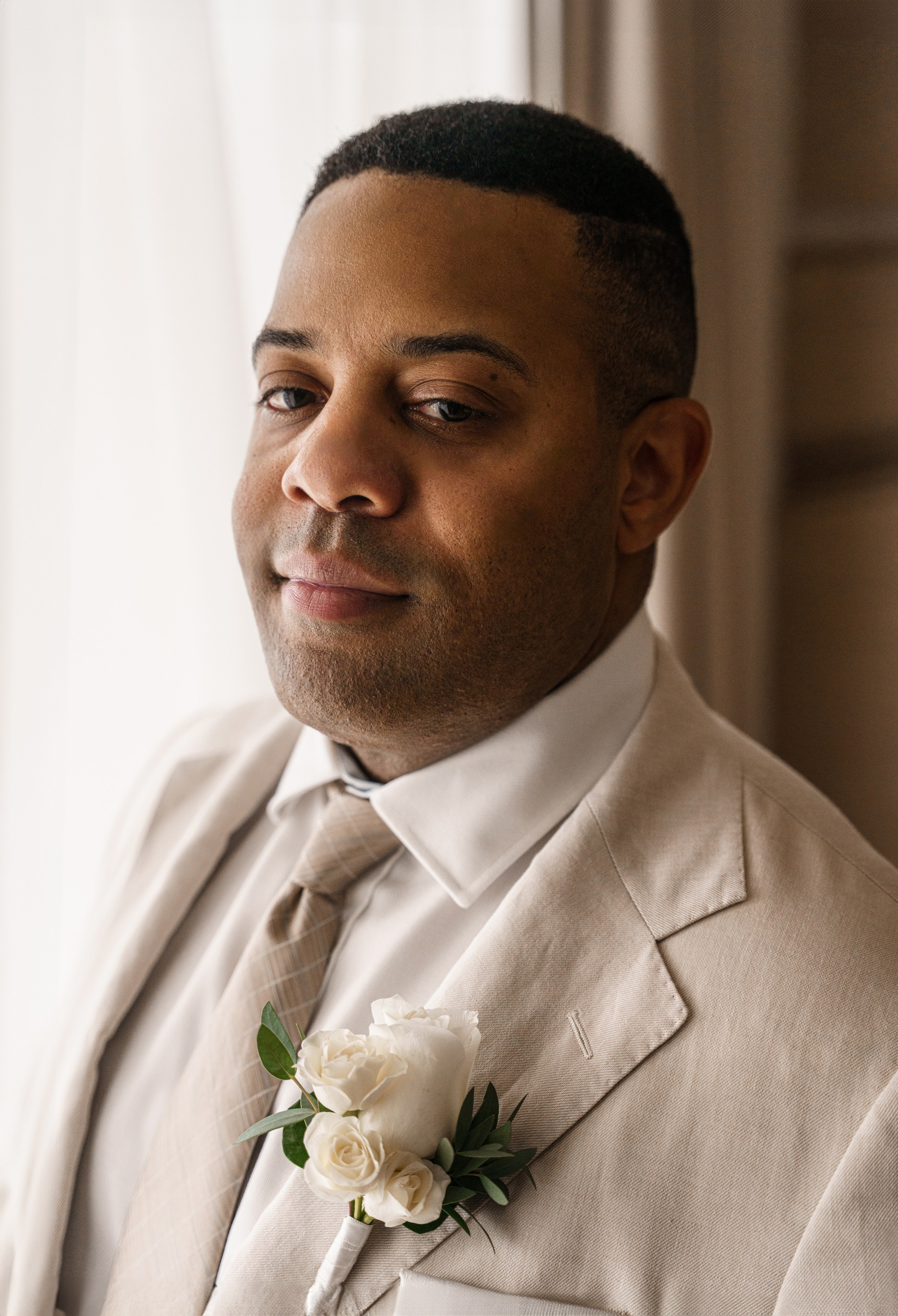 Groom getting ready photo by luxury wedding photographer in Cancun