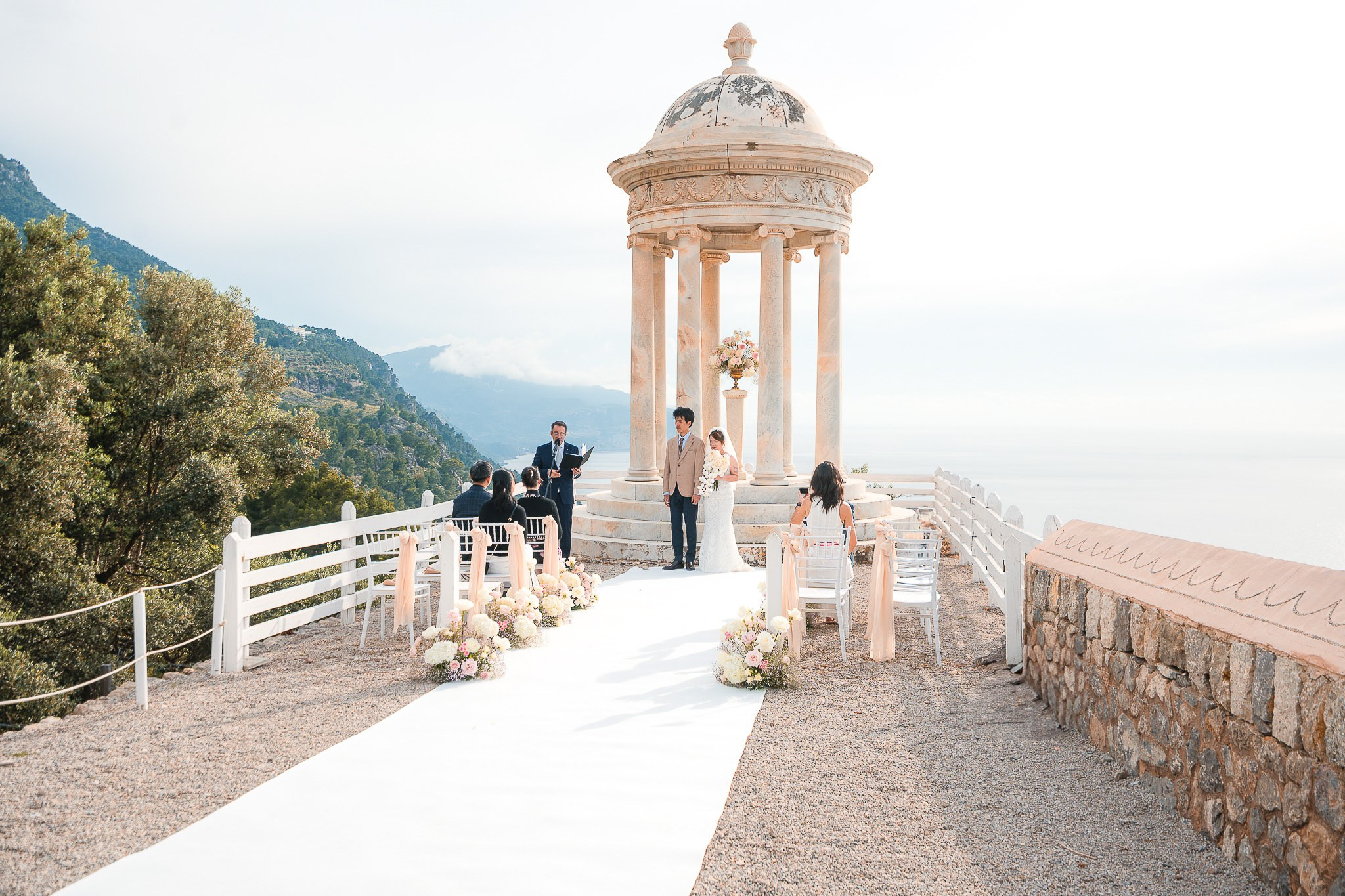 Bride and groom smiling at each other during their luxury Mallorca wedding venue ceremony
