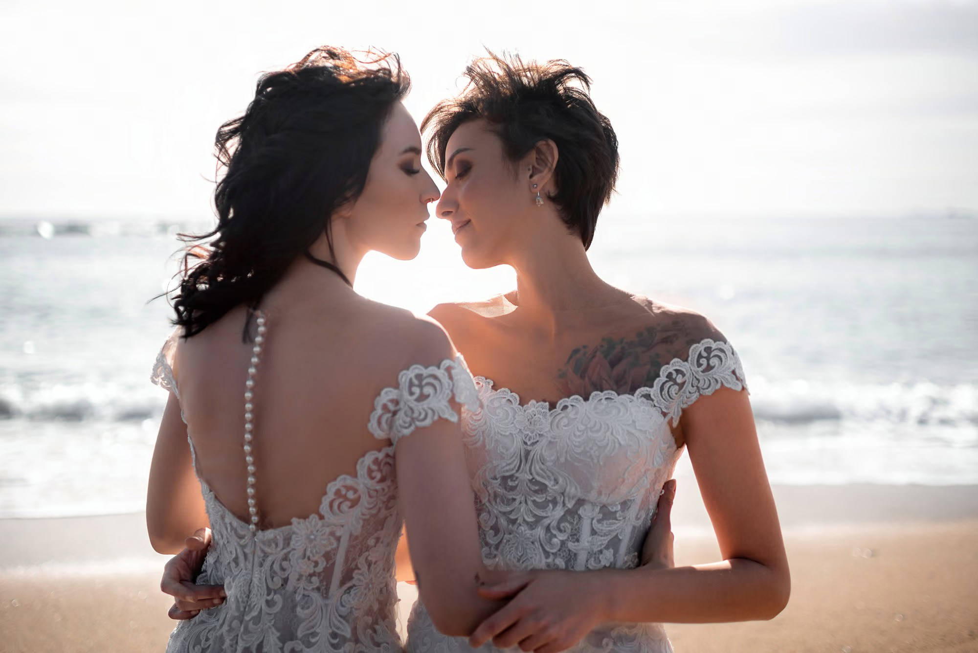 LGBT couple photography in Punta Cana capturing authentic moments between two women by the Caribbean Sea.