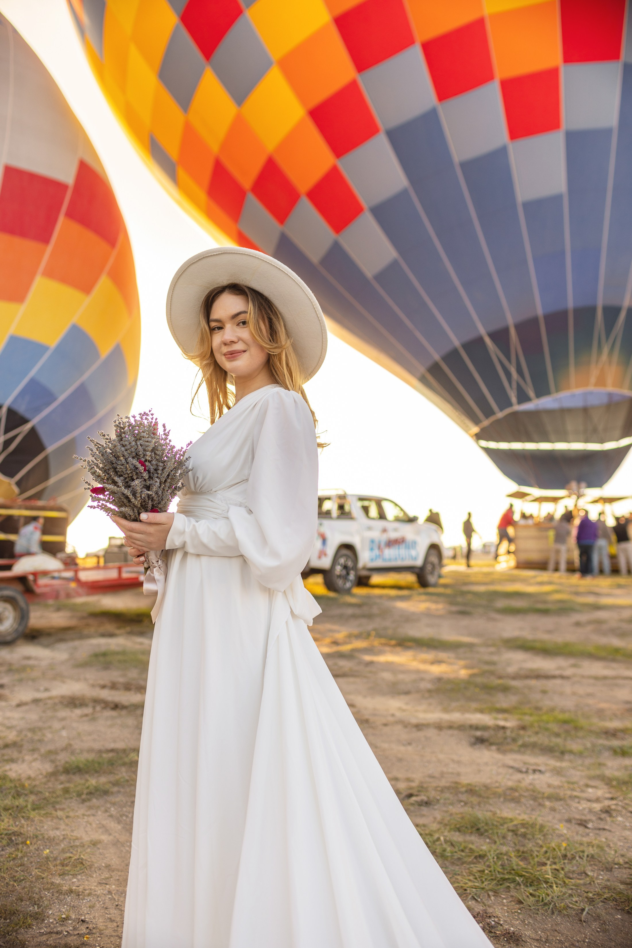 Elegant Wedding Photoshoot with a Flowing Dress and Balloons in Cappadocia. Julia Ganch I Fashion Wedding Photography I Cappadocia Turkey
