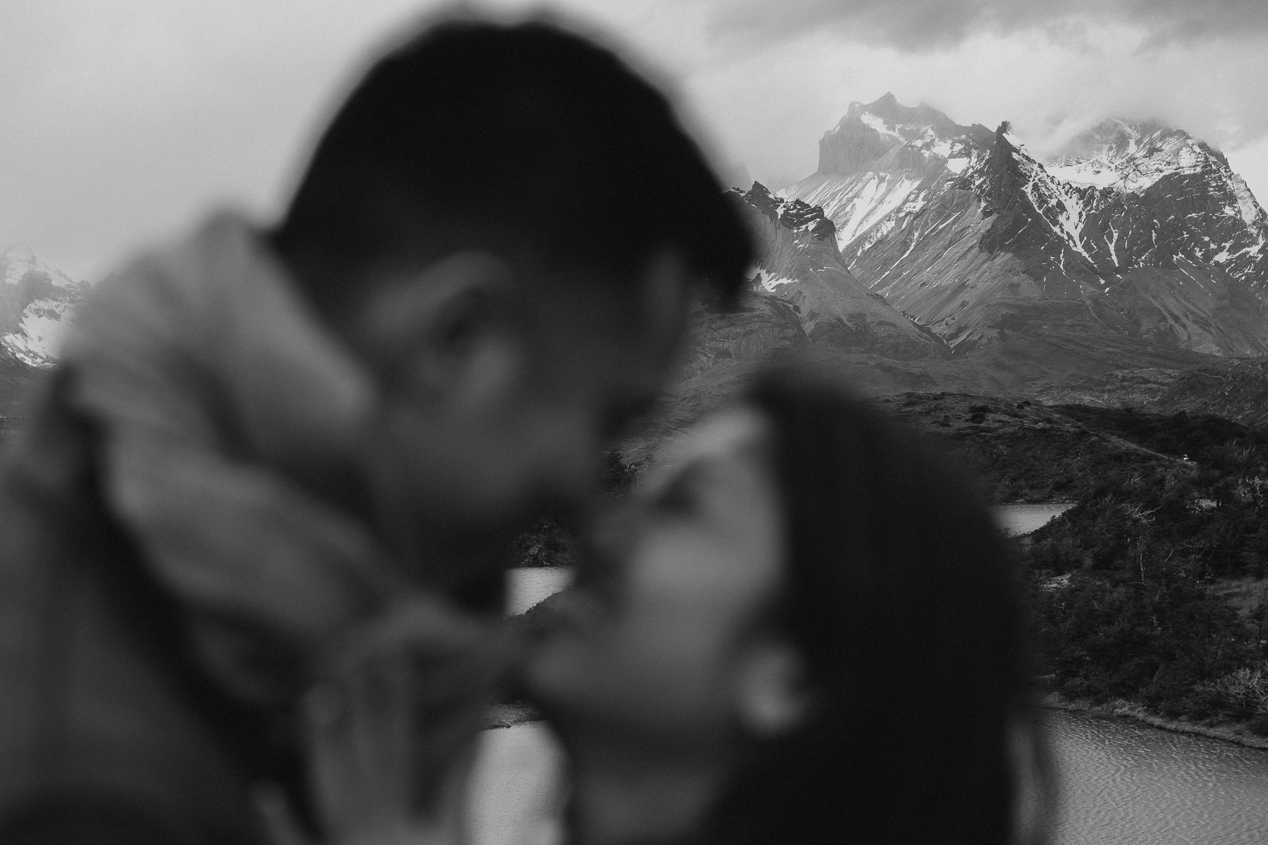Romantic kiss overlooking Torres del Paine mountains